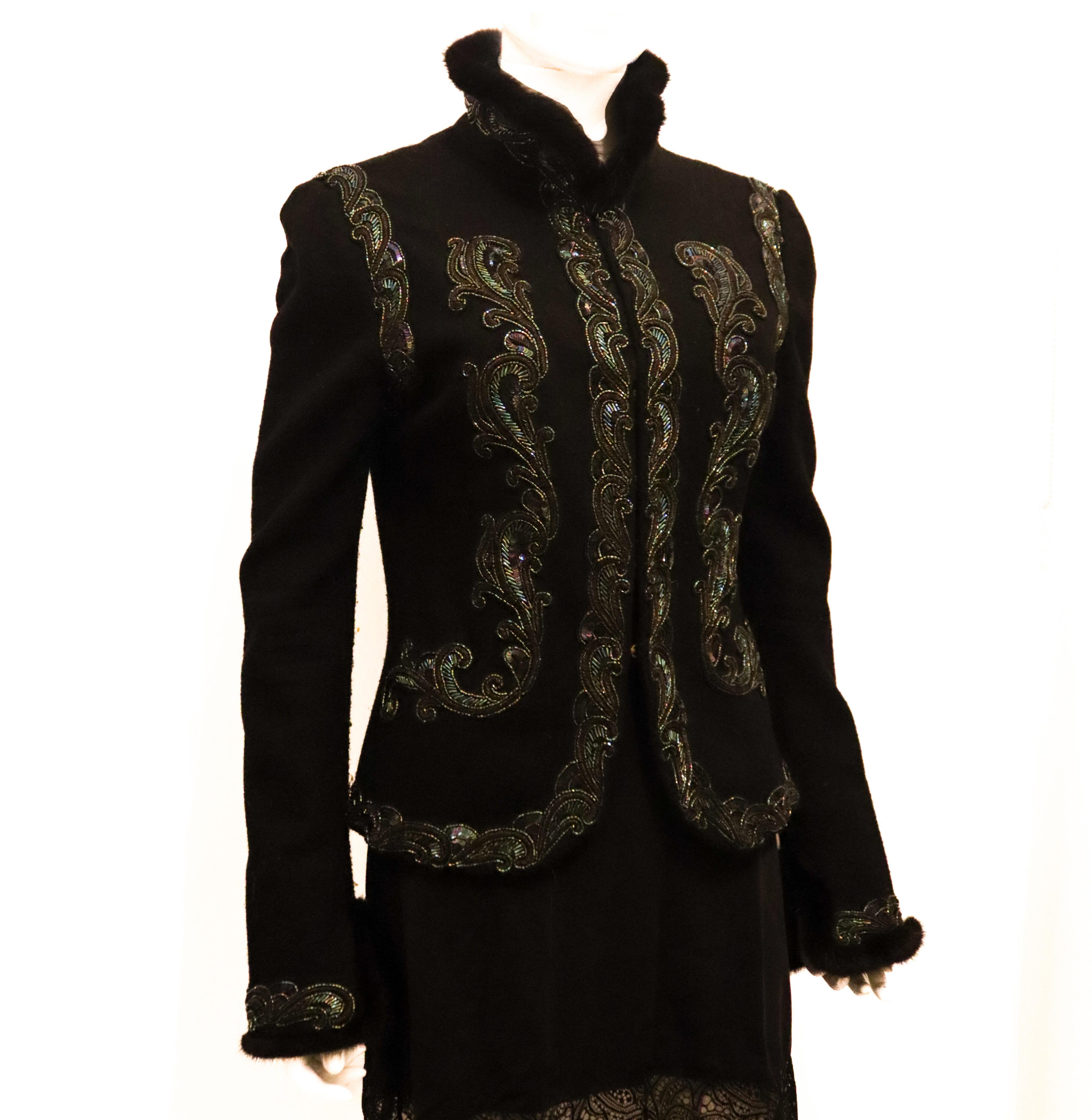 A head turning jacket by Andrew GN Paris. This wool jacket has stunning sequin decoration, a stand up collar and is edged in mink. It fastens at the front with hooks and eyes. AW 2005 97% wool, 1% elastathane , 2% mink .  Made in France Size M.