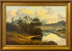 Scottish Highlands scene with golden light and tranquil mountain lake view
