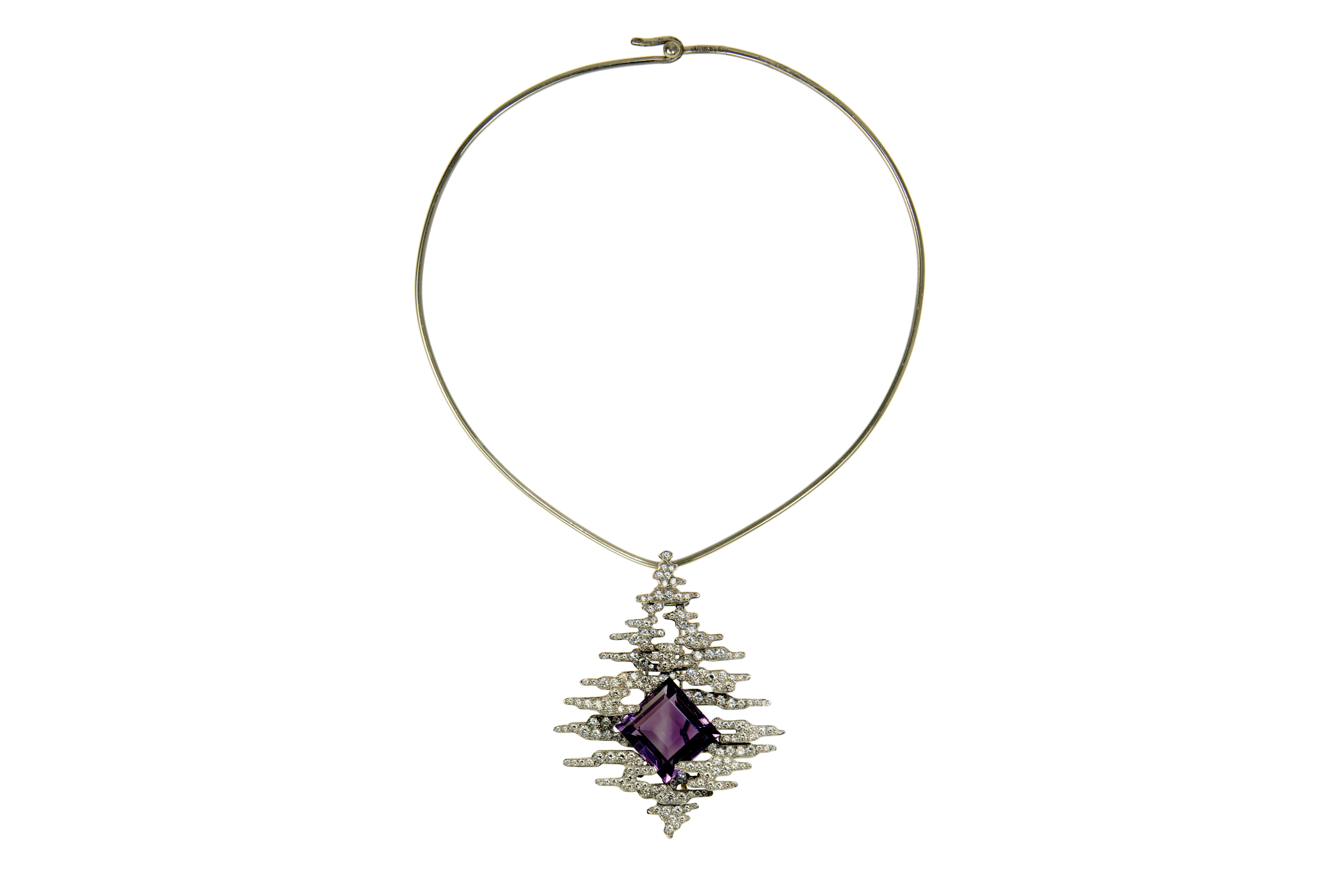 A square cut amethyst, pavé-set diamond, and 18 karat white gold pendant, on an 18 karat white gold torque, by Andrew Grima, made in 2002. The amethyst weighs approximately 35.00 carats, and the diamonds weigh approximately 5.30 carats.

The pendant