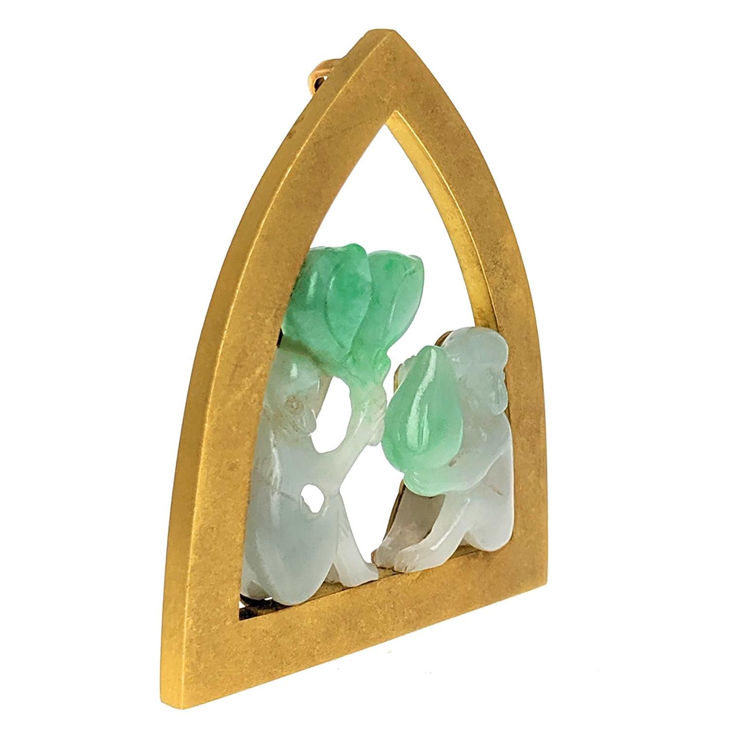 Of openwork design, comprising two carved green jadeite monkeys holding palm leaves, sitting on the ledge of a  brushed gold arch-shaped window, mounted in 18k yellow gold, signed Grima, with maker’s mark AGLtd for Andrew Grima, with London Assay