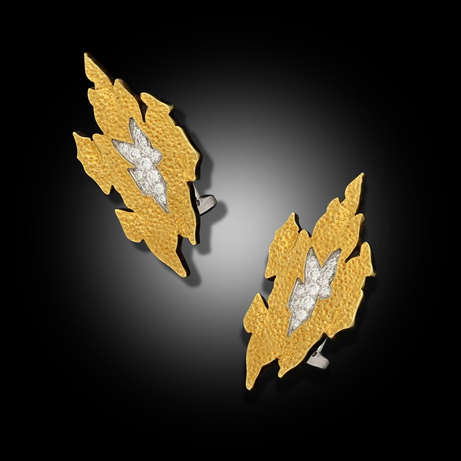 Maker:
Andrew Grima
Summary:
Vintage Textured Gold & Diamond Earrings
A pair of vintage gold and diamond earrings by Andrew Grima, circa 1980. The earrings are both of a stylised flame design with textured gold and and set to the centre with an