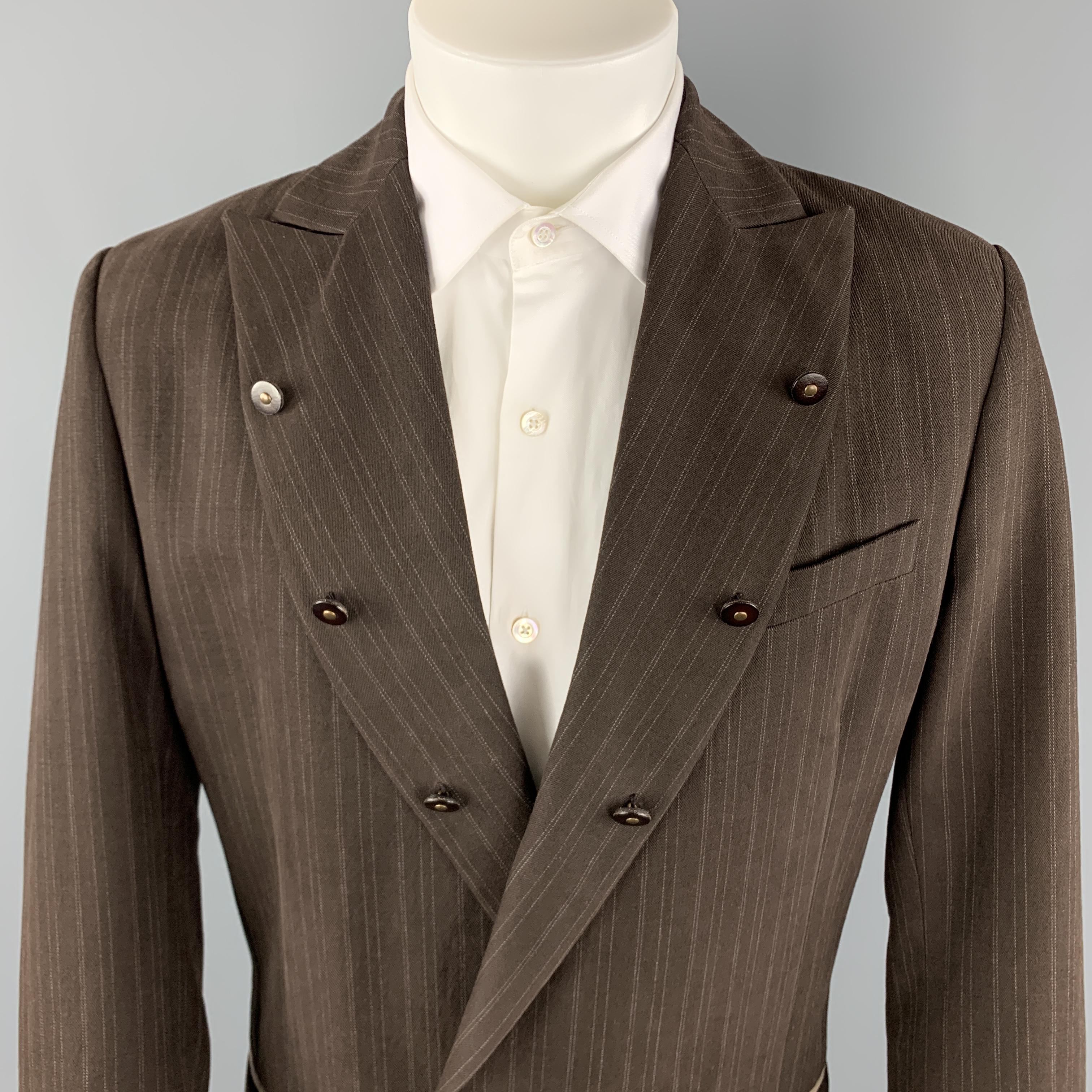 ANDREW MACKENZIE Sport Coat comes in a brown stripe cotton / wool material, with a peak lapel, buttons trim, slit and flap pockets and buttoned cuffs. Made in Italy.

Excellent Pre-Owned Condition.
Marked: IT 48

Measurements:

Shoulder: 18 in.