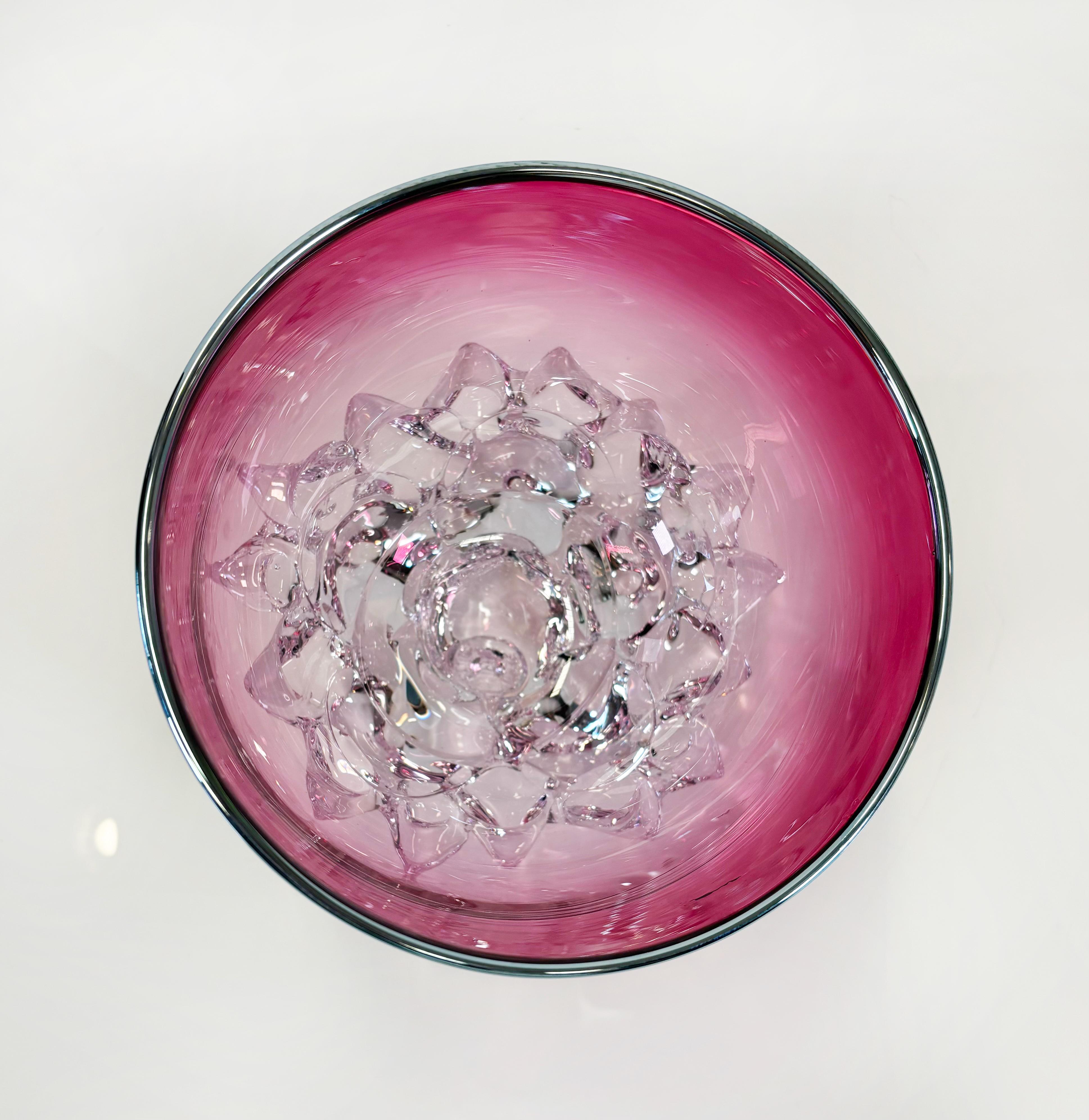 As a student and instructor of glass blowing for over twenty years, Andrew Madvin has an extremely unique vision when it comes to contemporary glass. 

Studying at many different schools across the United States, including the world-renowned