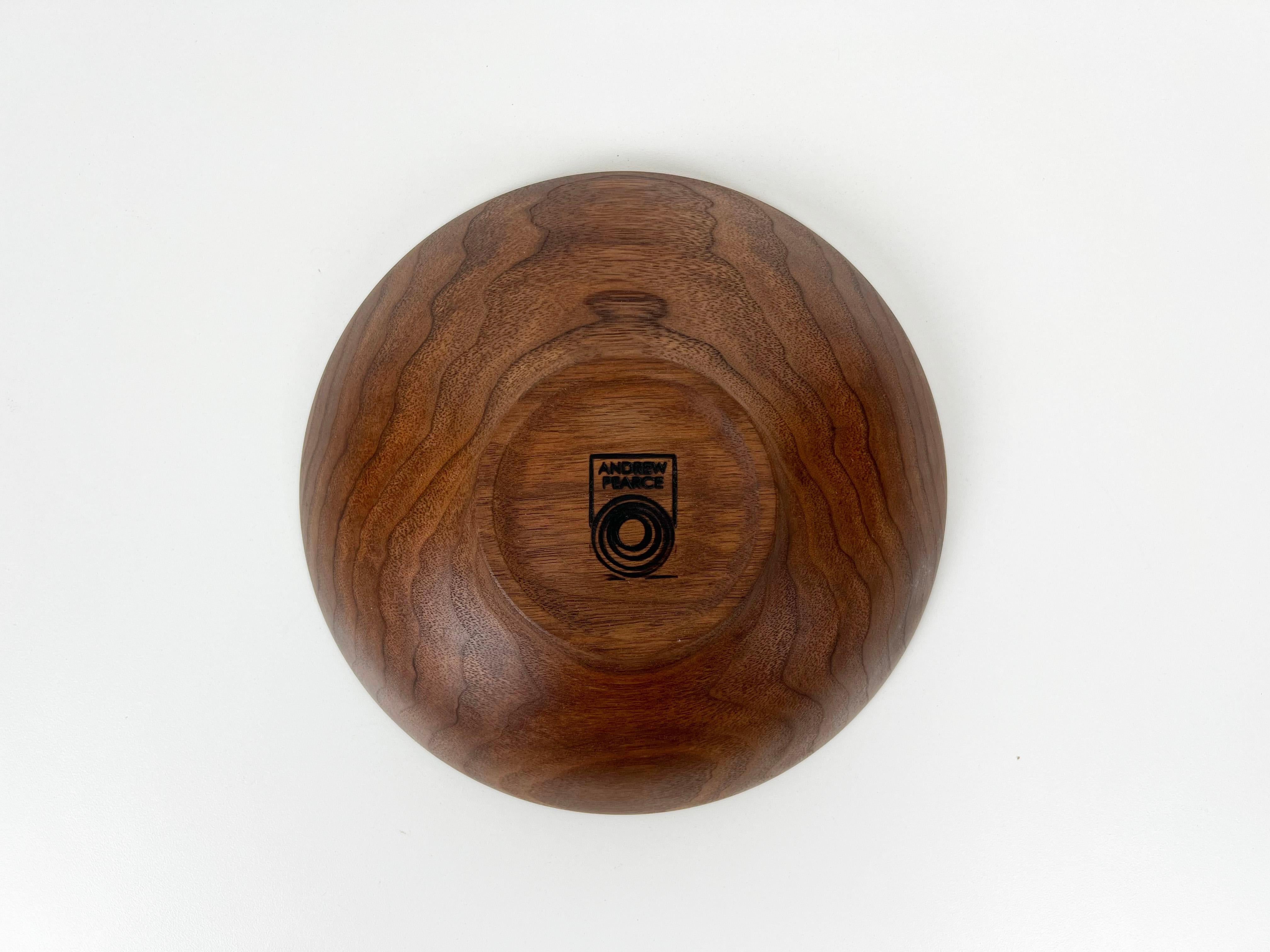 Hand-turned solid wood Champlain serving bowl crafted from beautiful walnut by Andrew Pearce. Finished with food safe allergen-free wood oil.

Artist: Andrew Pearce

Year: 2000s

Origin: Vermont, USA

Dimensions: 2.75