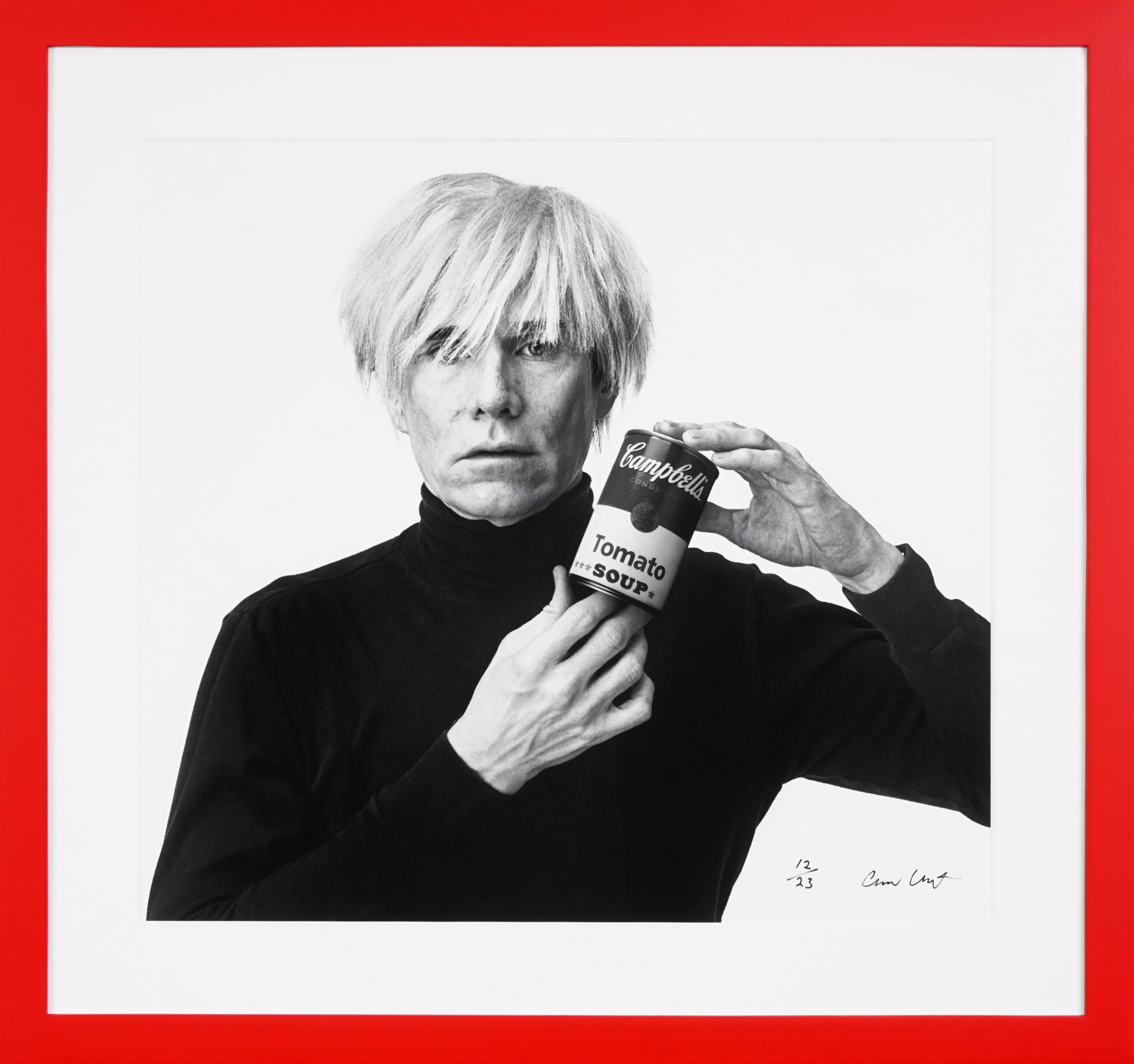 The archival photographic pop-art print, ‘Andy Warhol with Red Campbell’s Soup’  was created in 1985 by photographer Andrew Unangst. Taken in New York City, Unangst had the opportunity to meet and photograph Andy Warhol for a campaign with Vidal