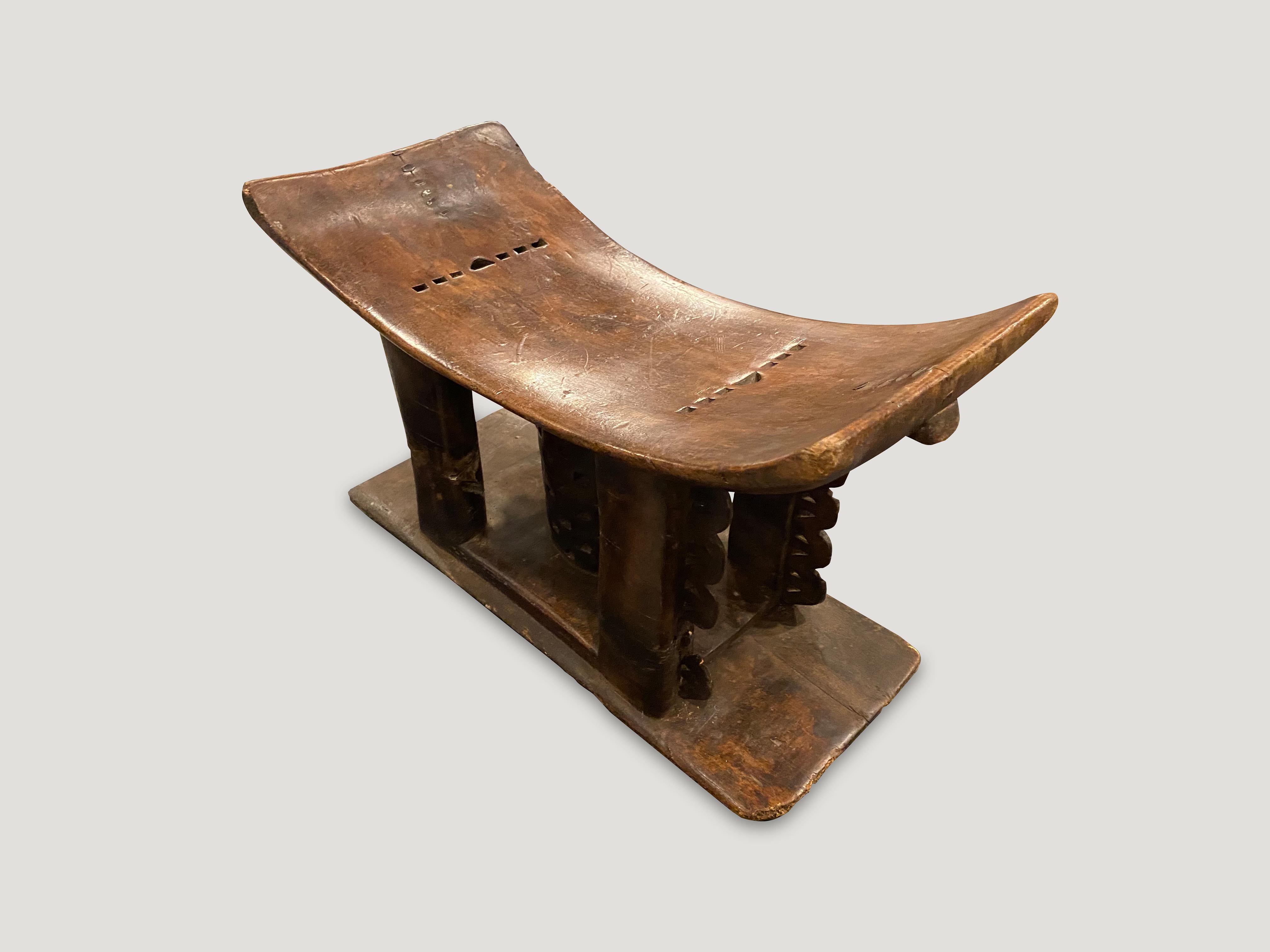 Lovely patina on this antique Ashanti bench or stool, hand carved from a single piece of wood from West Africa, early 20th century. The seat is 8” high and the sides 11” high.

This bench was sourced in the spirit of wabi-sabi, a Japanese