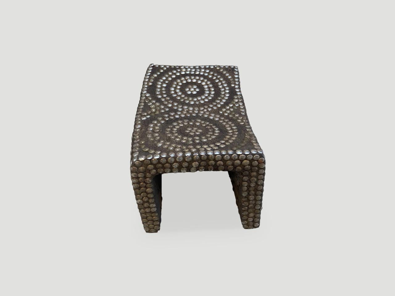 Ngombe Congo royal throne, said to be a queens stool or tabouret denoting prestige and high status. From the general area along the Congo river, West Africa. Hand carved from a formidable, heavy wood with brass and iron nail studs.

This stool was