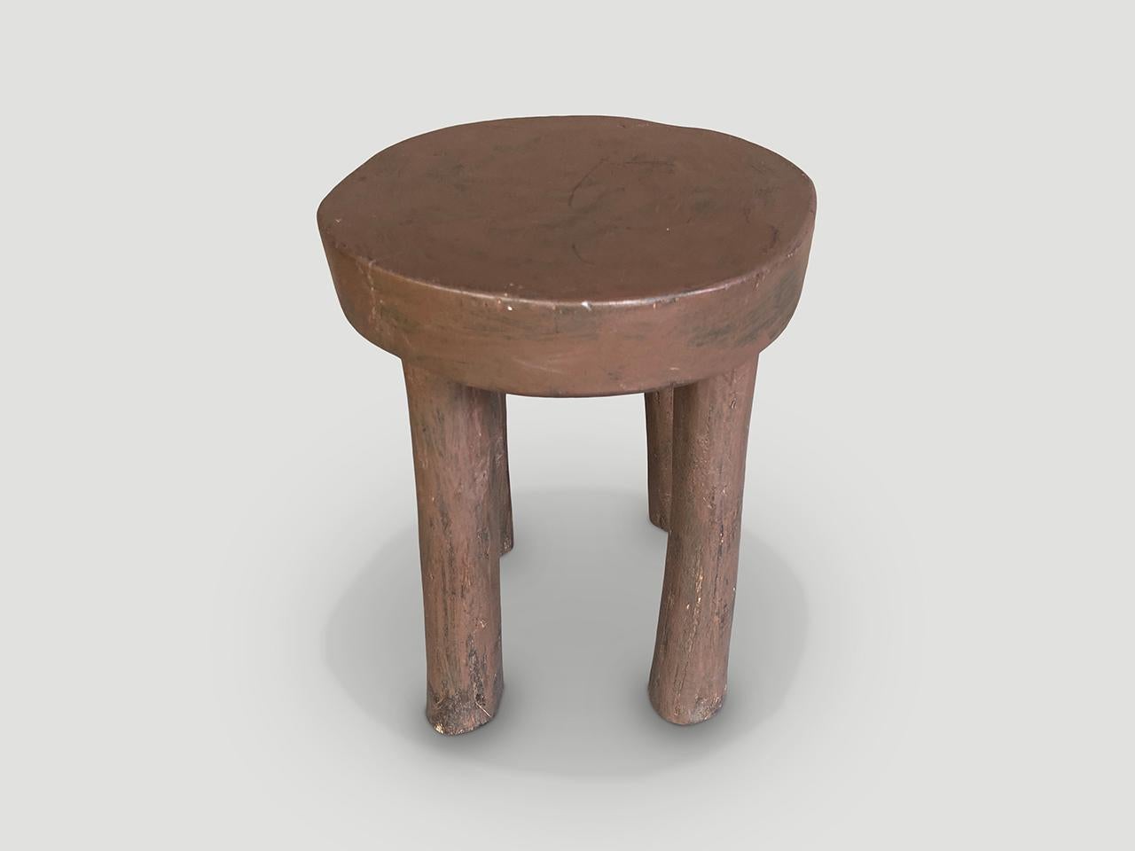 Antique African side table or stool hand carved from a single block of wood. 

This side table or stool was sourced in the spirit of Wabi-Sabi, a Japanese philosophy that beauty can be found in imperfection and impermanence. It is a beauty of