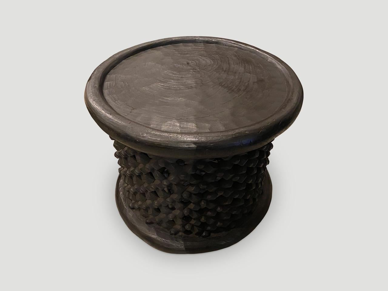 African coffee table or side table hand carved from one piece of wood from Cameroon, featuring a lattice pattern. We have stained the entire piece black. We only source the best.

This coffee table or side table was sourced in the spirit of