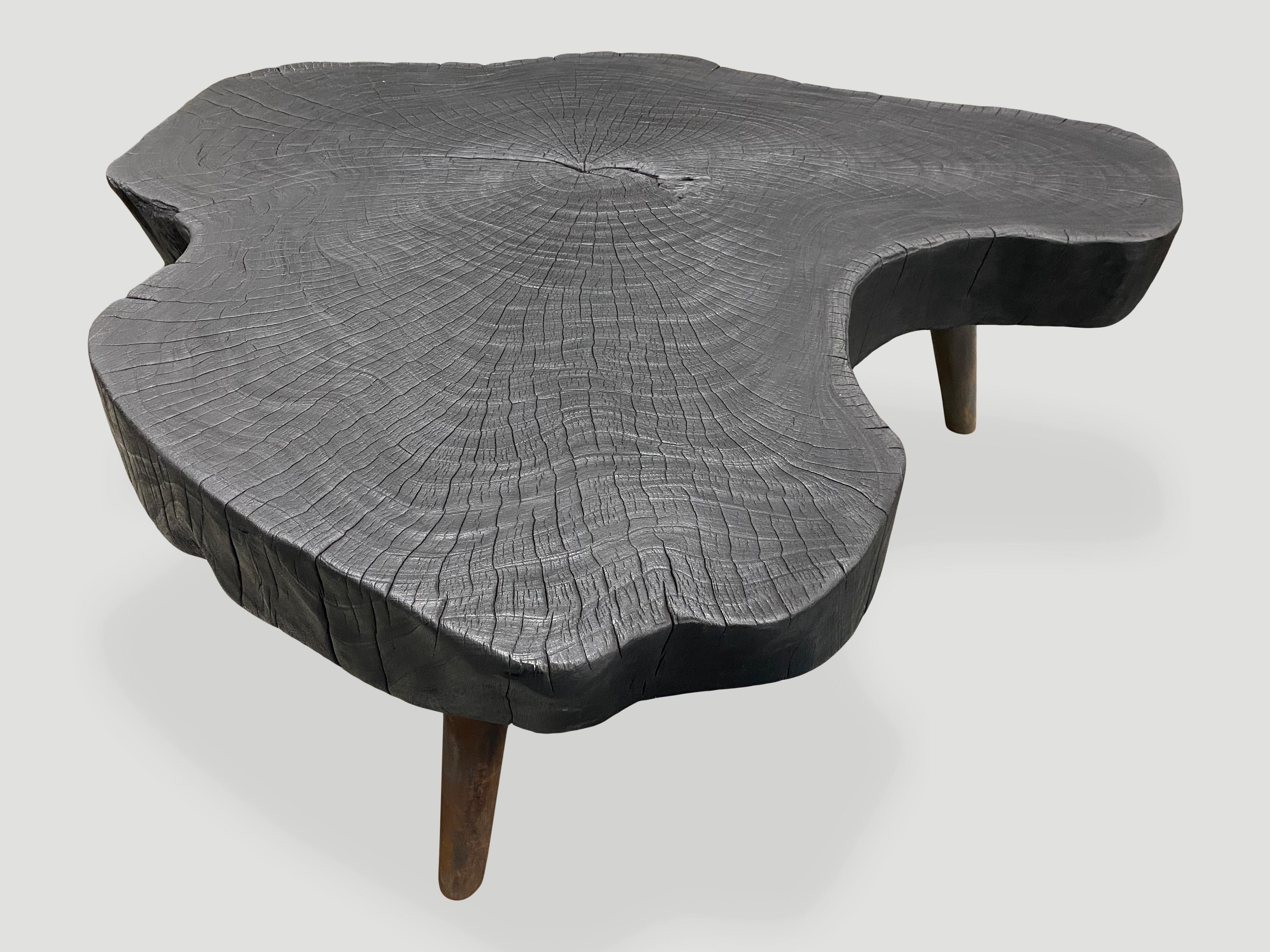 Impressive four inch thick slab coffee table, charred sanded and sealed exposing the beautiful grain of the wood. Set on mid century style burnt metal legs, which we can also finish In pure black if preferred. 

The Triple Burnt Collection