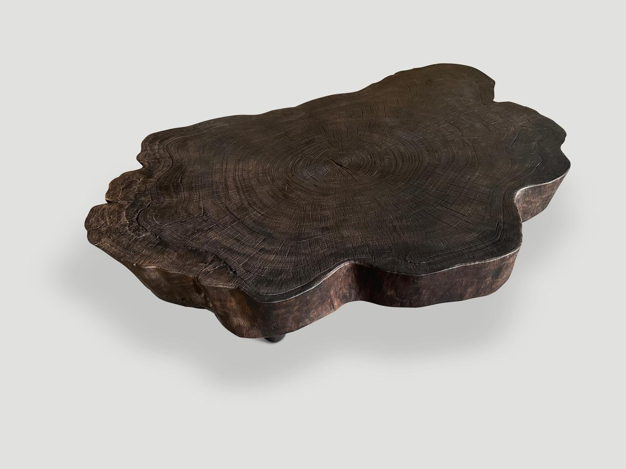 Impressive reclaimed five inch slab mango root coffee table, floating on minimalist cone legs. Charred, sanded and sealed revealing the beautiful wood grain. All one of a kind in the same style. Custom finishes available. Please inquire.

The Triple