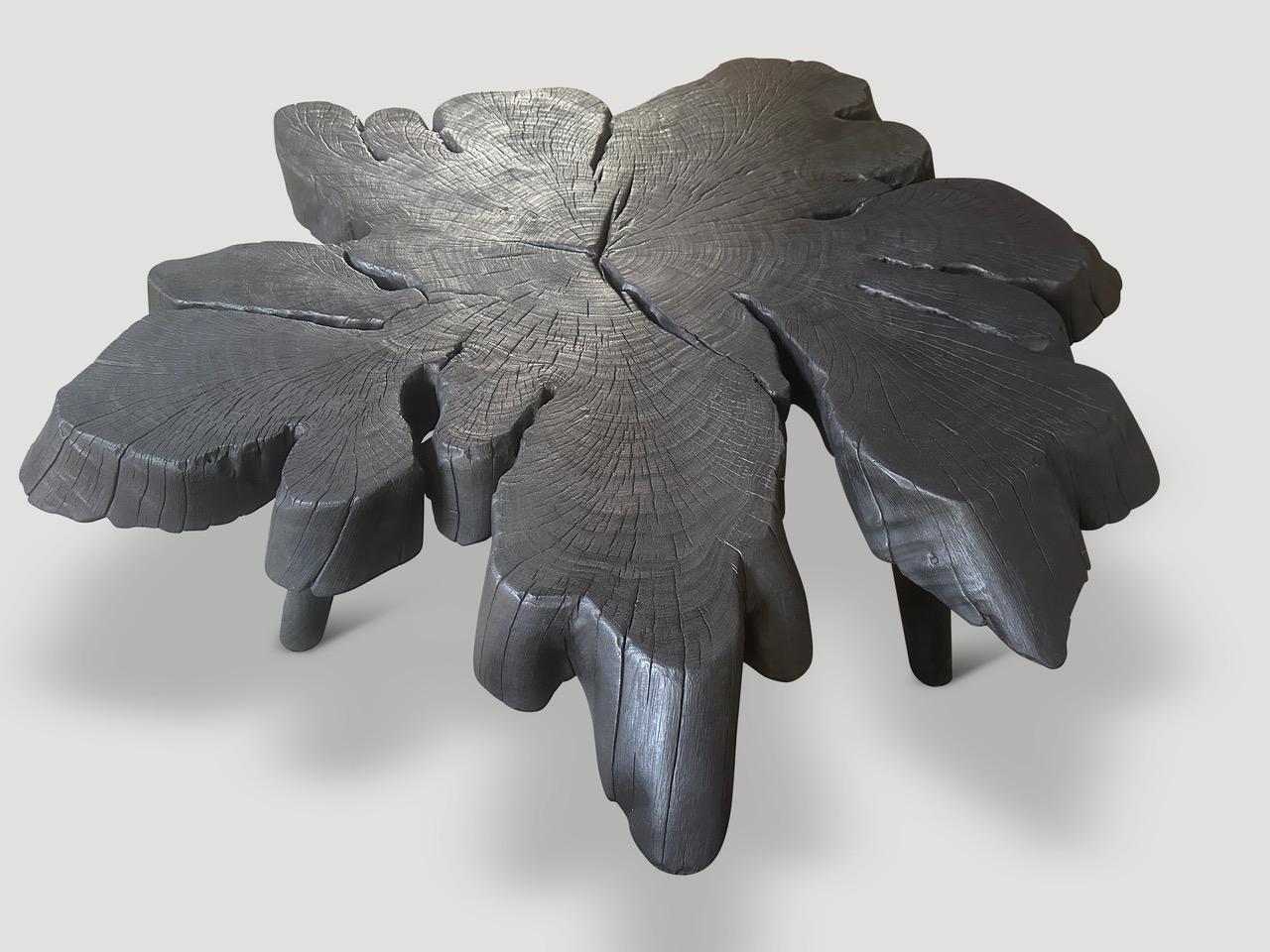 Impressive four inch charred rosewood coffee table floating on four minimalist cylinder legs. Burnt, sanded and sealed revealing the beautiful wood grain. It’s all in the details.

The Triple Burnt Collection represents a unique line of modern