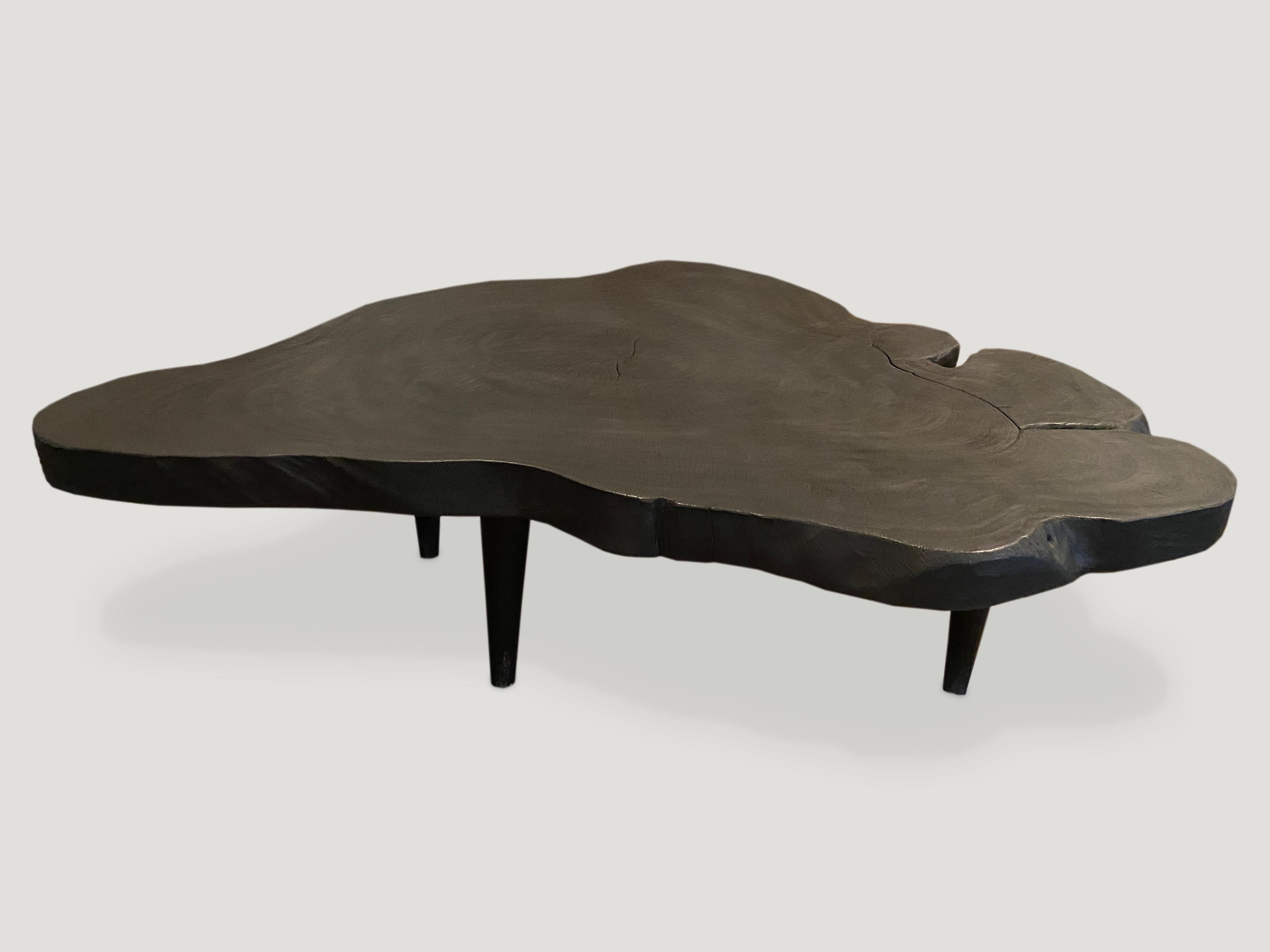 Reclaimed suar wood coffee table made from a single three inch slab. Charred and set on mid century style legs. A perfect combination of modern and organic.

The Triple Burnt Collection represents a unique line of modern furniture made from solid