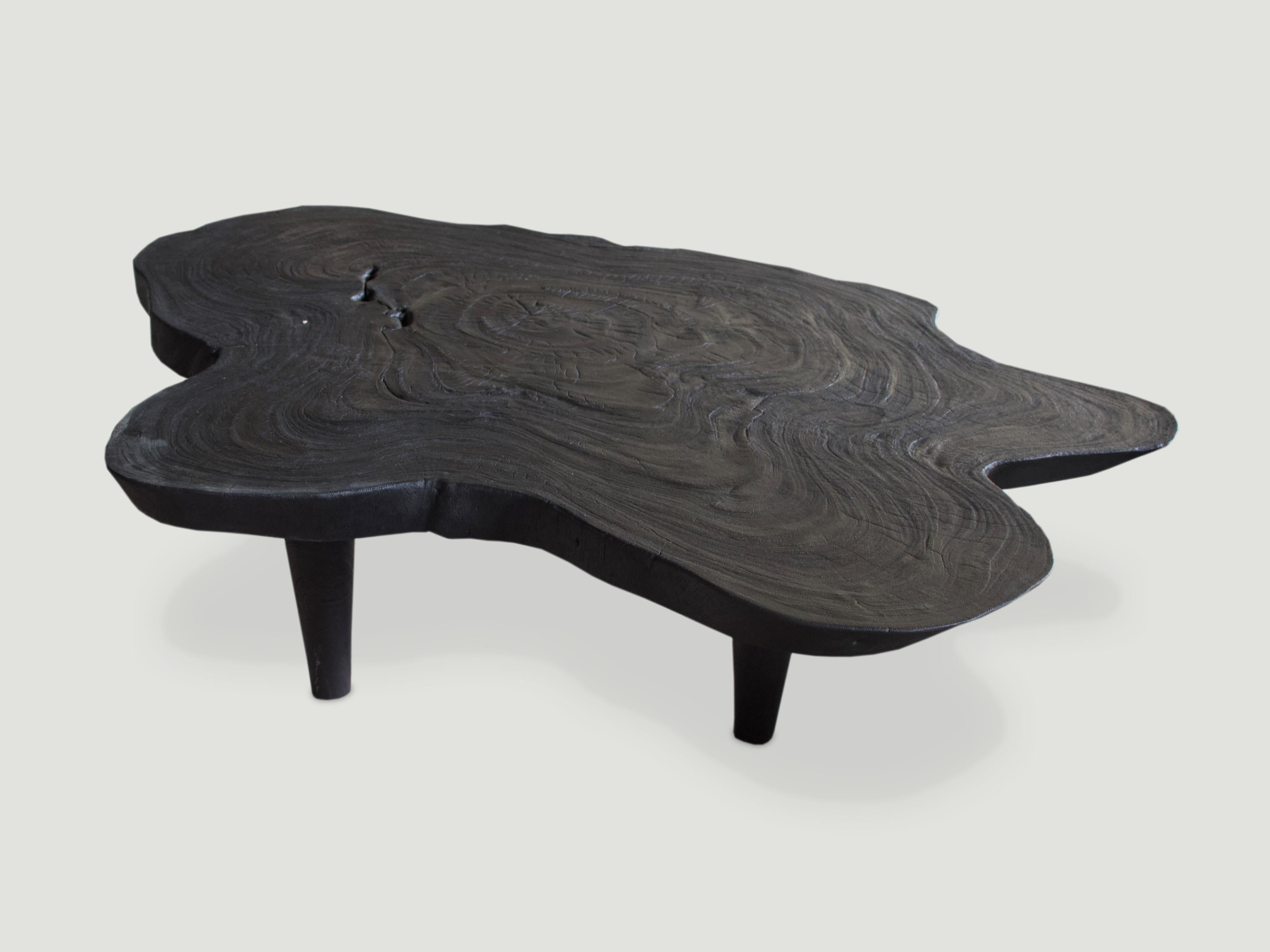 Reclaimed single slab suar wood coffee table. Charred and set on mid century style legs. A perfect combination of modern and organic.

The Triple Burnt Collection represents a unique line of modern furniture made from solid organic wood. Burnt