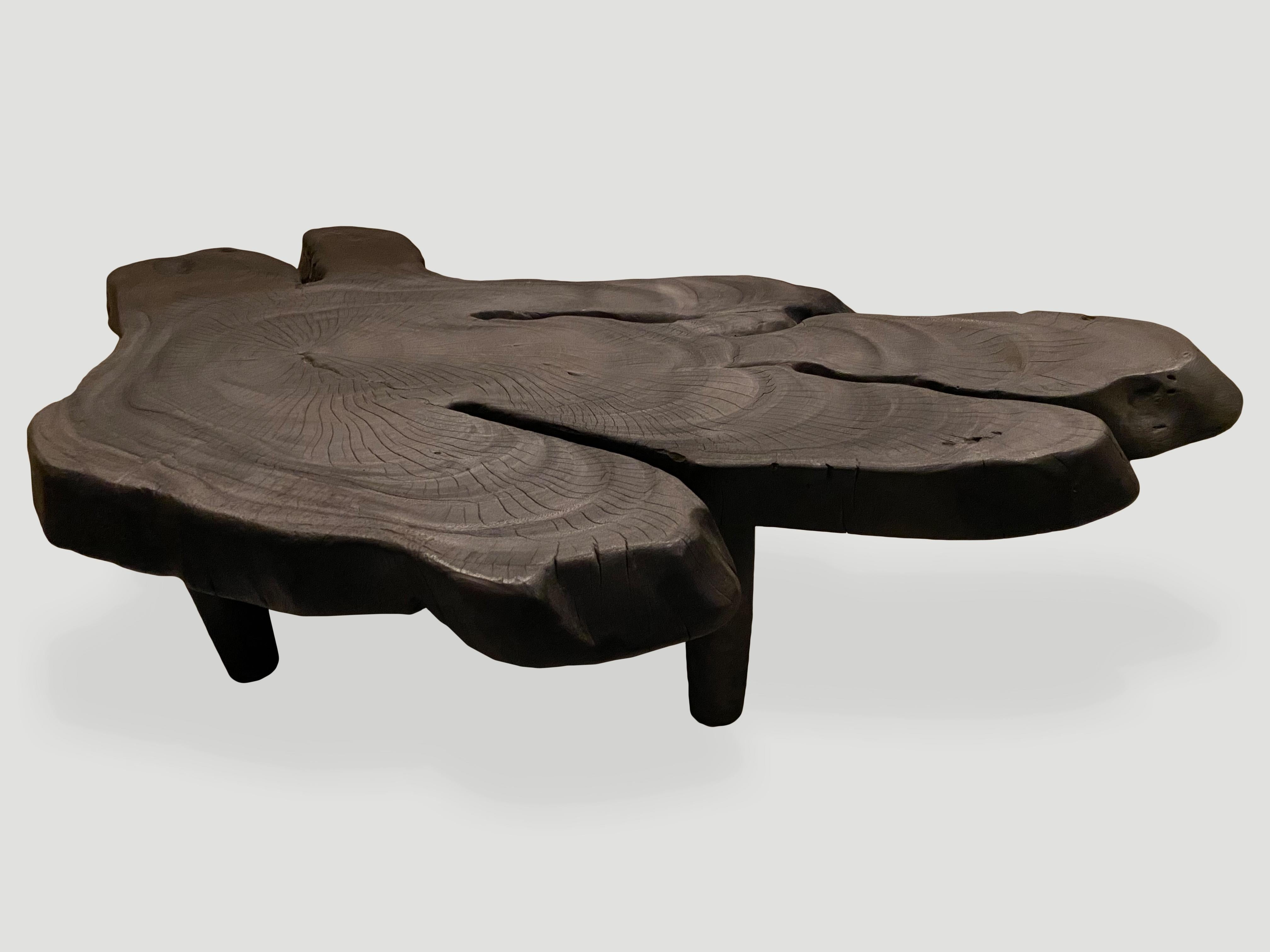 Impressive hand carved reclaimed suar wood coffee table with a 4