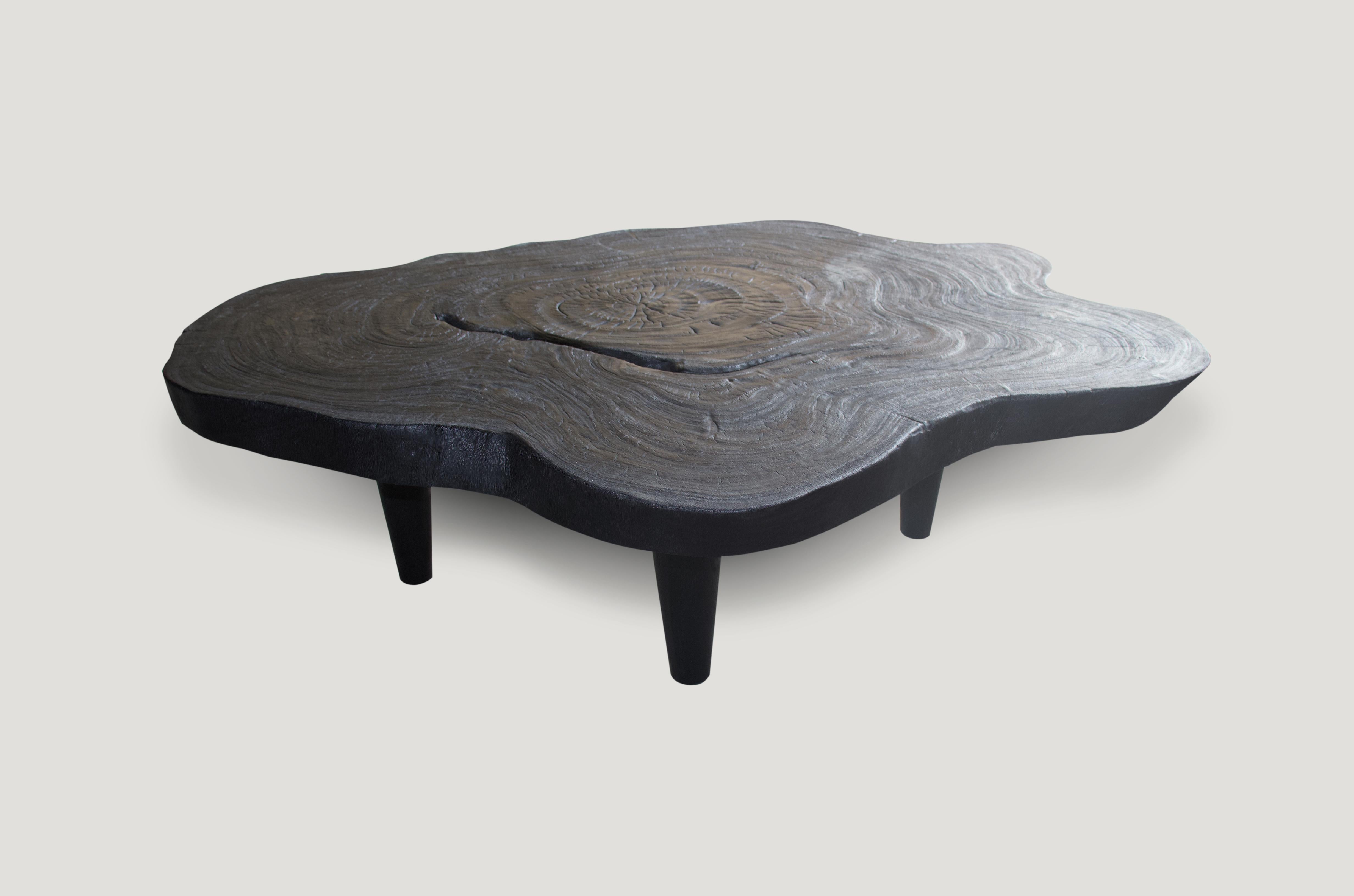 Single three inch slab reclaimed suar wood coffee table. Charred and set on midcentury style legs. A perfect combination of modern and organic.

The Triple Burnt collection represents a unique line of modern furniture made from solid organic wood.