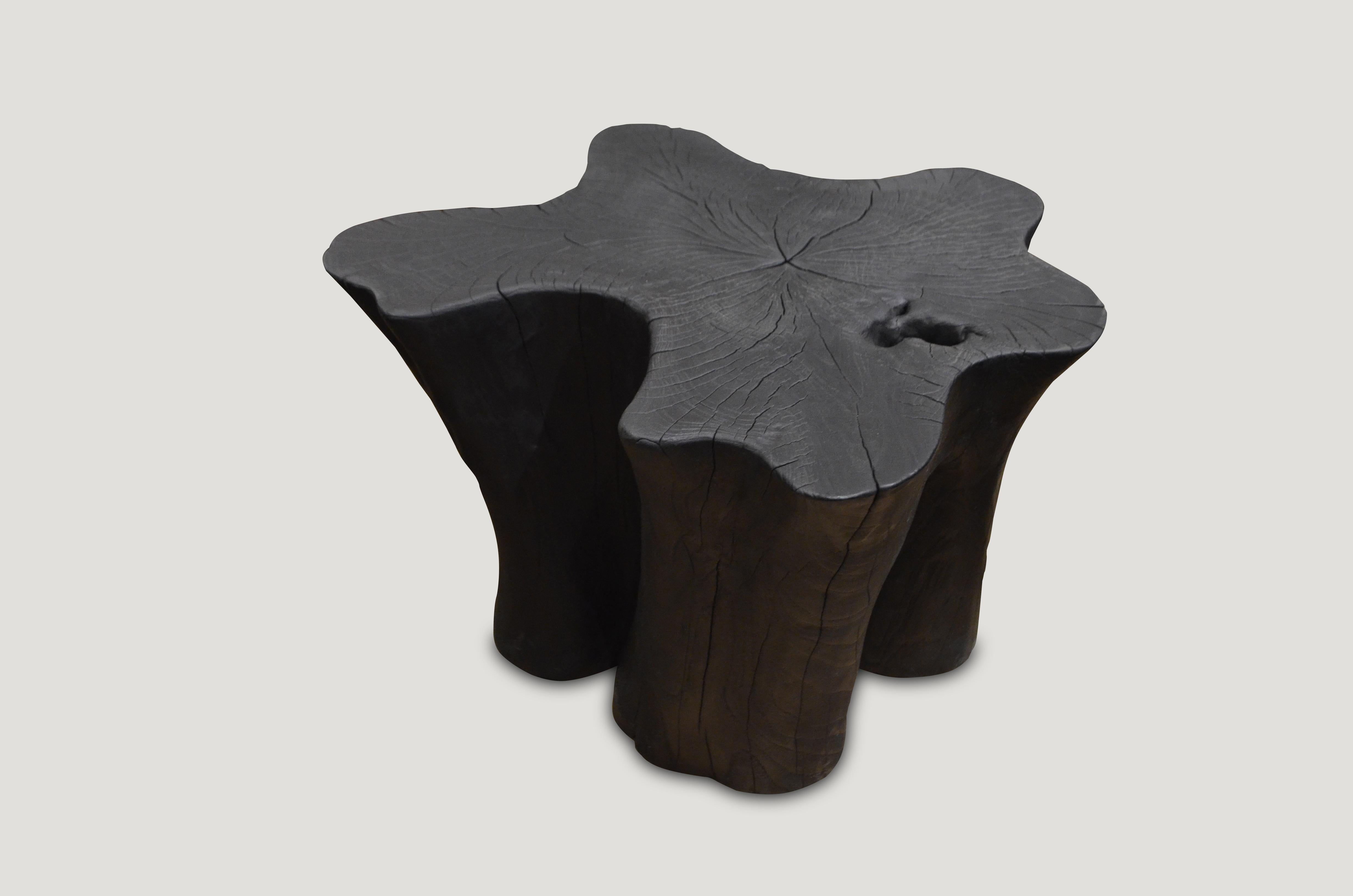 Side table burnt, sanded and sealed leaving the grain of the wood exposed.

The Triple Burnt collection represents a unique line of modern furniture made from solid organic wood. Burnt three times to produce a rich, charcoal finish with impressive