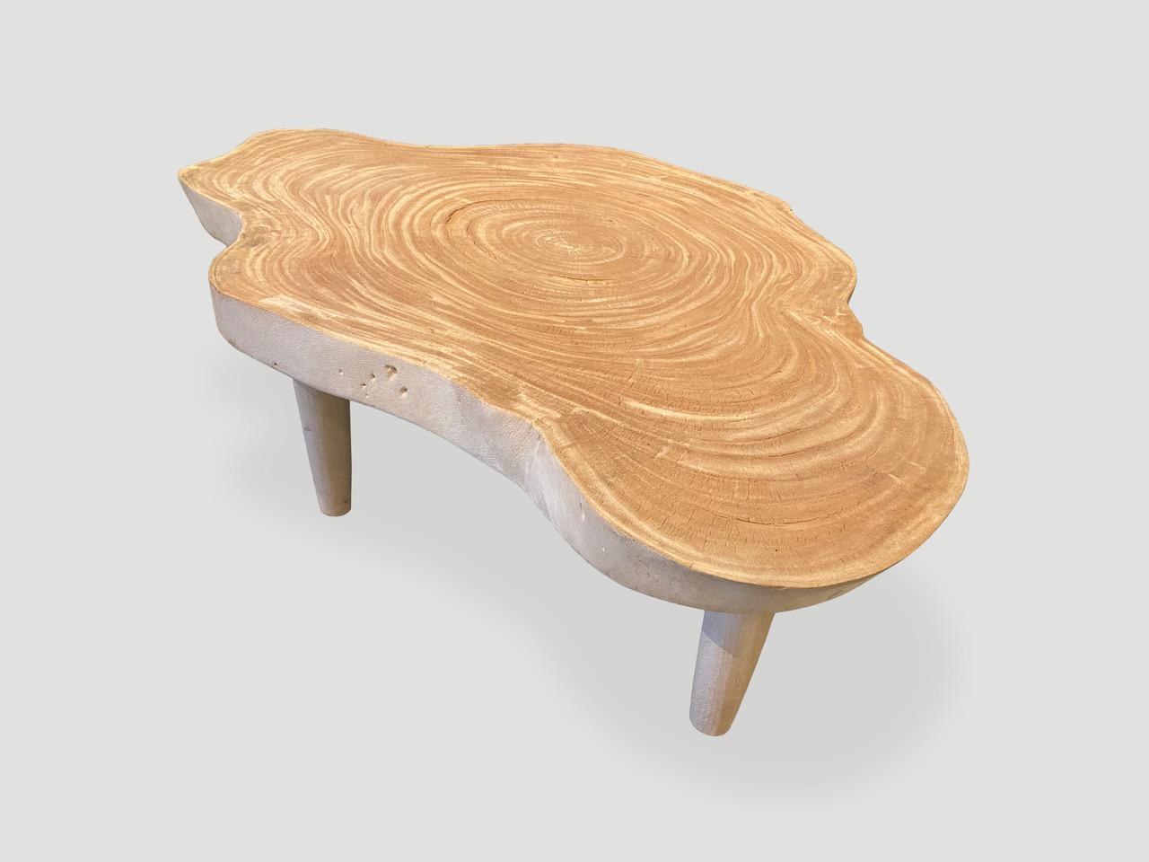 Impressive three inch slab coffee table, set on cone shaped mid century style legs. The wood is unknown though indigenous to Indonesia. We love the natural way it ‘crackles’ after we applied the bleach to the wood and left in the sun to turn this