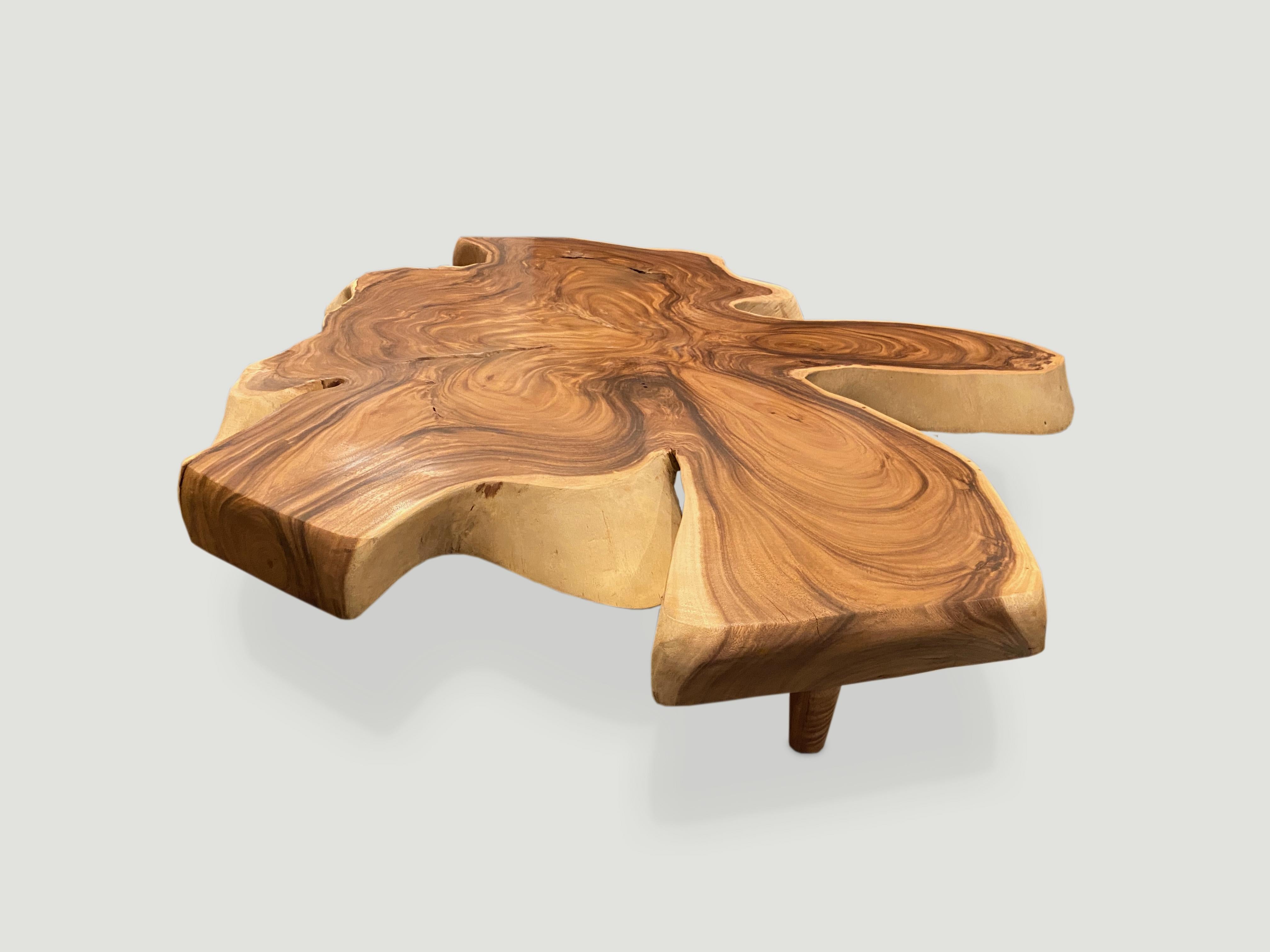 Impressive reclaimed four inch thick slab suar wood coffee table. We added the midcentury style legs and polished the top with a natural oil finish to enhance the grain. Organic is the new modern.

Andrianna Shamaris. The Leader In Modern Organic