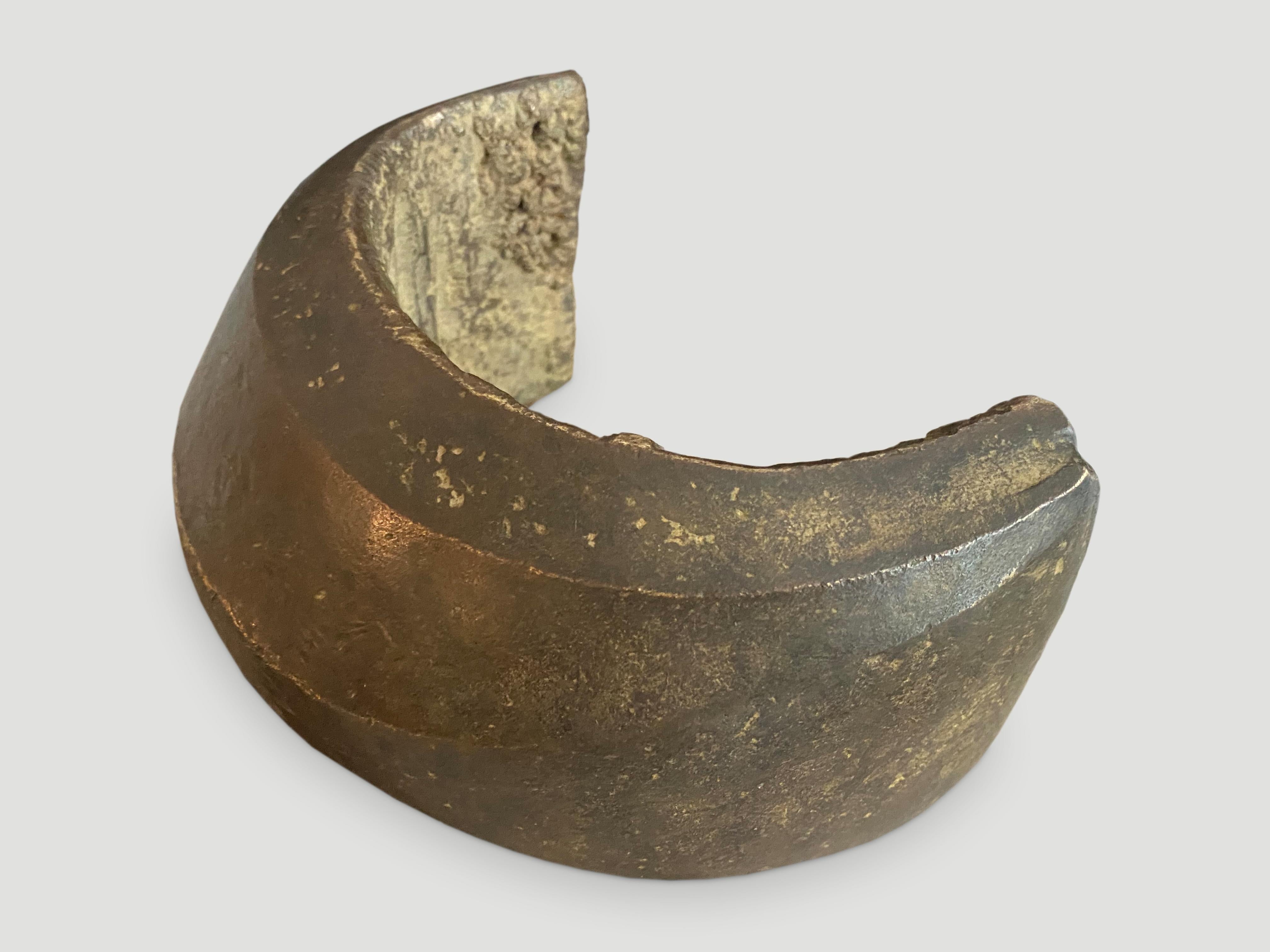 Beautiful antique African art object originally used as currency. Lovely patina and shape on this rare solid piece that could also be put on a stand.

This African currency was sourced in the spirit of wabi-sabi, a Japanese philosophy that beauty