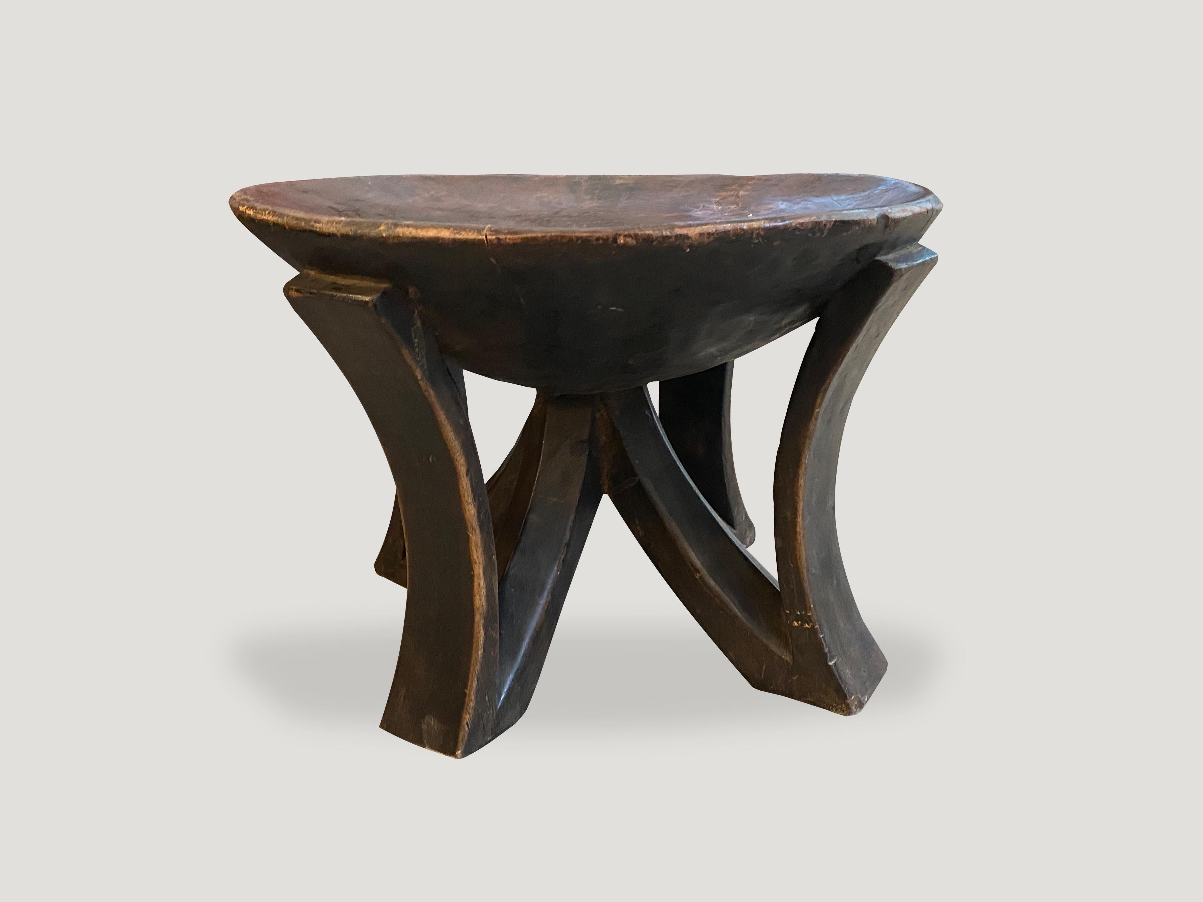Hand carved from a single piece of mahogany wood, an African mahogany side table or bowl. Great for placing a book or perhaps towels in a bathroom, magazines etc. A beautiful, versatile item that is both sculptural and usable.

This side table or