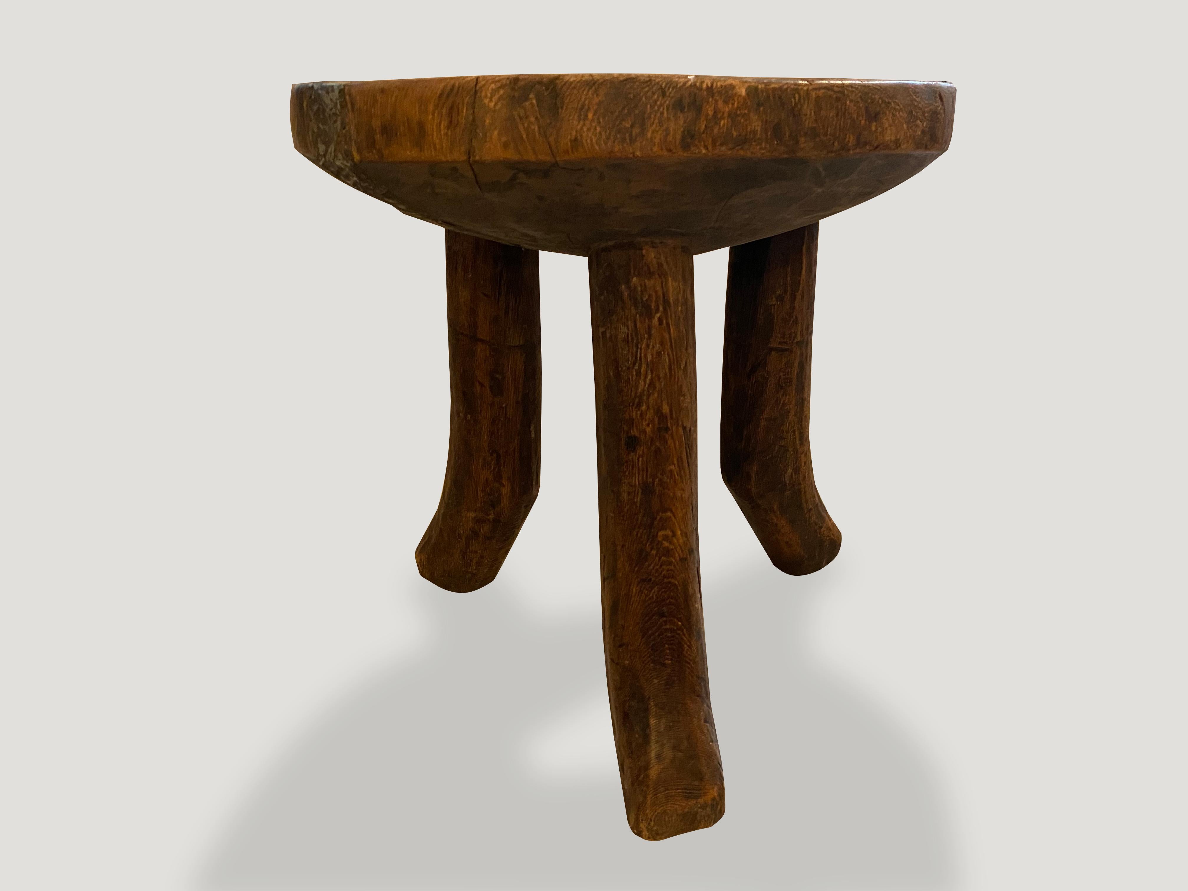 Impressive antique African mahogany side table or bowl, hand carved from a single piece of mahogany wood. Great for placing a book or perhaps towels in a bathroom, magazines etc. A beautiful, versatile item that is both sculptural and usable.