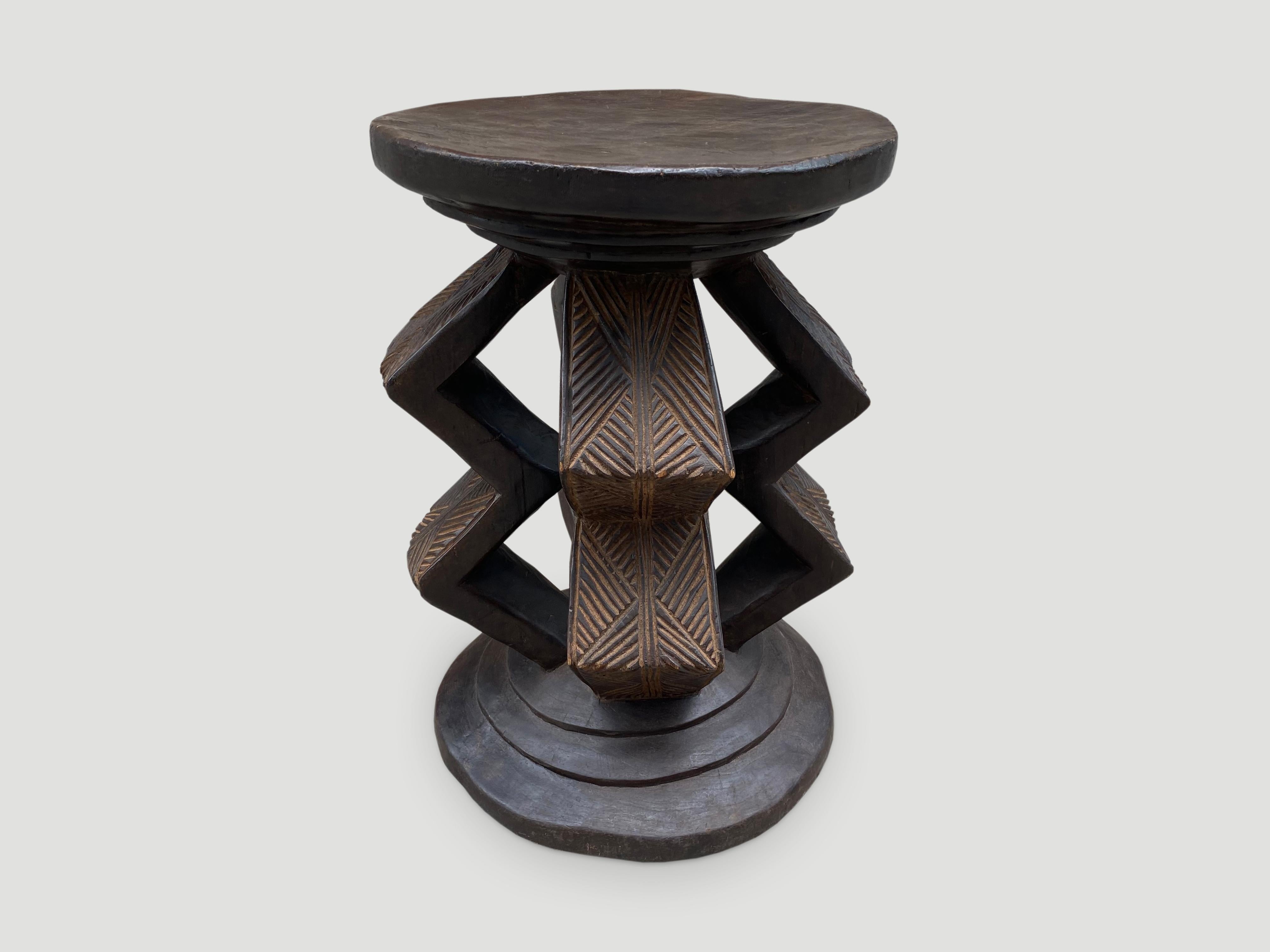 Beautiful hand carved African side table or pedestal. Rare large scale, hand carved out of a single block of mahogany wood. We only source the best.

This side table or pedestal was sourced in the spirit of wabi-sabi, a Japanese philosophy that