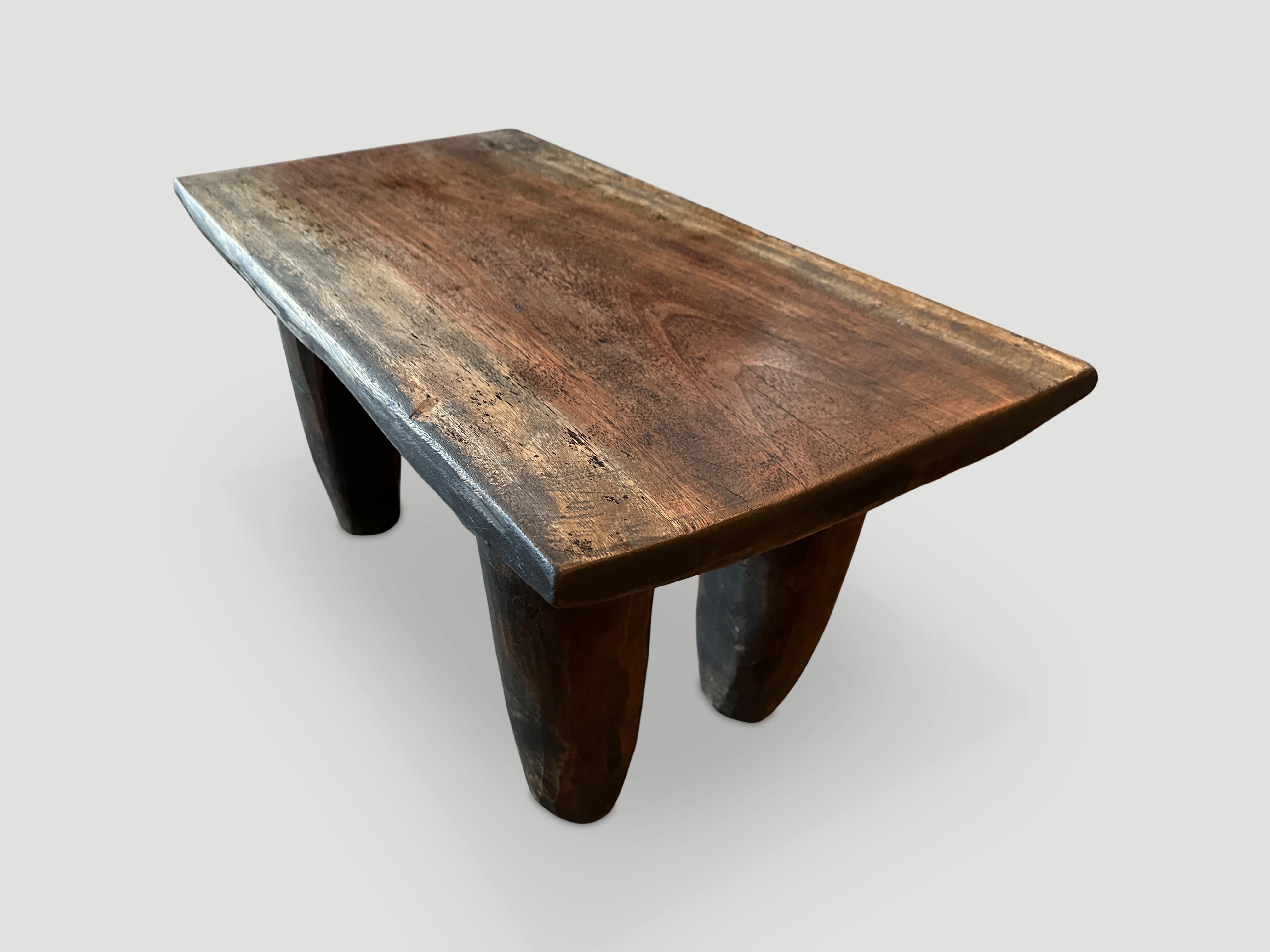 Antique coffee table or bench hand carved by the Senufo tribes from a single block of Iroko wood, native to the west coast of Africa. The wood is tough, dense and very durable. Shown with cone style legs. We only source the best. This one is