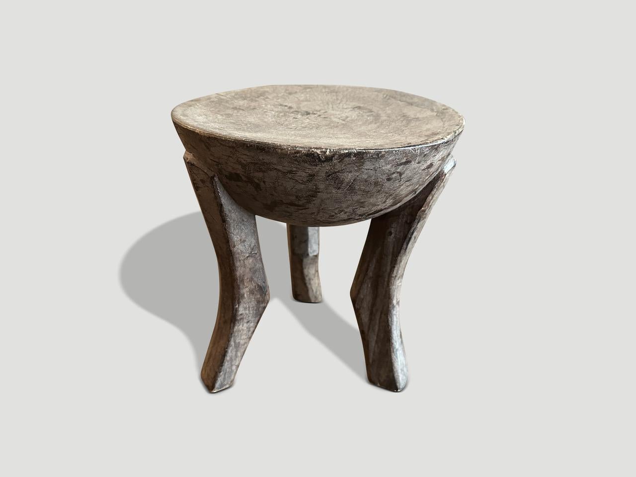 Antique African side table with milky wood tones. Hand carved from a single block of wood.

This side table was sourced in the spirit of Wabi-Sabi, a Japanese philosophy that beauty can be found in imperfection and impermanence. It is a beauty of