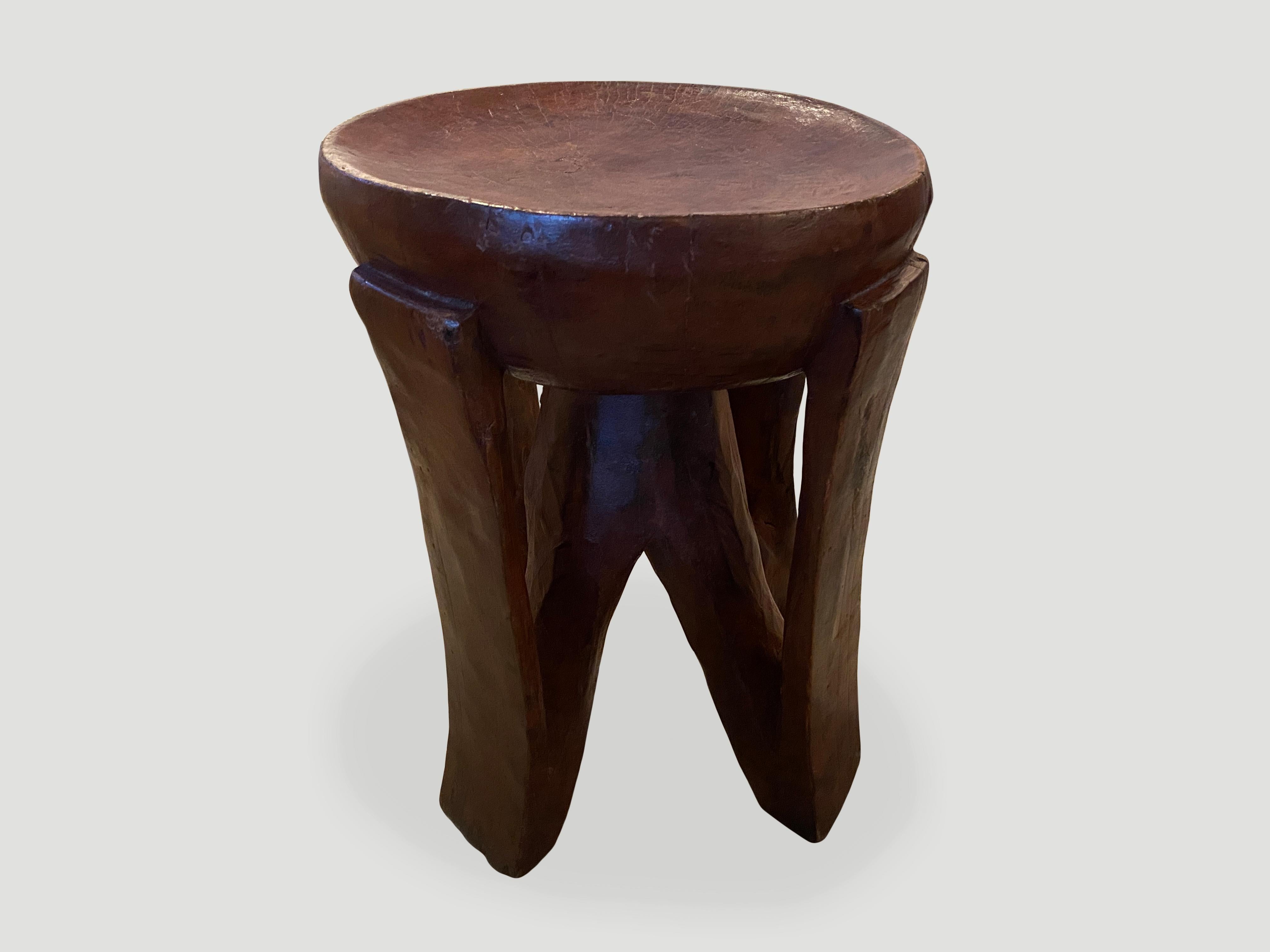Beautiful patina on this hand carved African side table or pedestal. Rare large scale, hand carved out of a single block of mahogany wood. We only source the best.

This side table or pedestal was sourced in the spirit of wabi-sabi, a Japanese