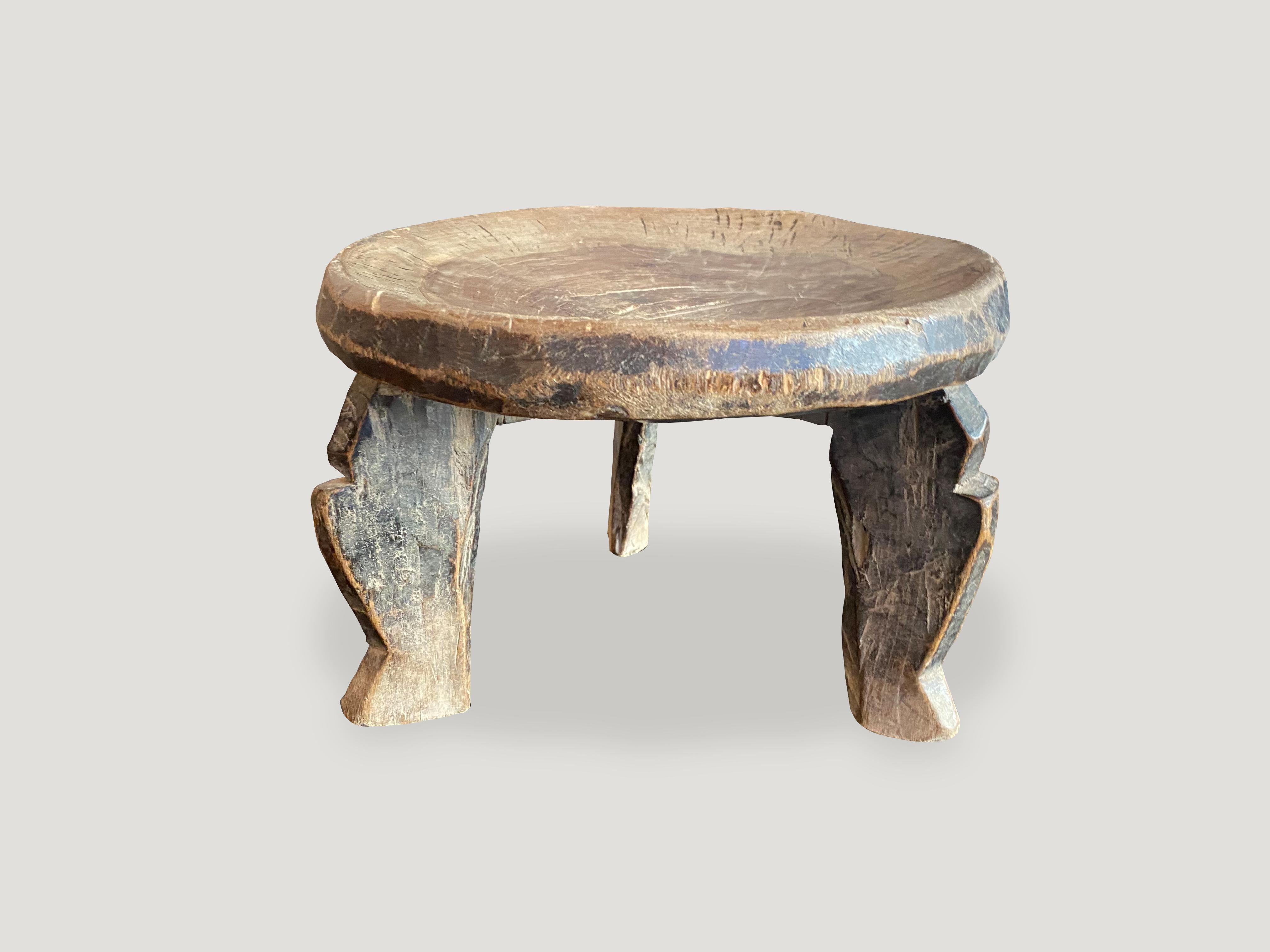 Beautiful hand carved African side table, stool or bowl with lovely patina. Celebrating the cracks and crevices and all the other marks that time and loving use have left behind. The entire piece is hand carved out of a single block of mahogany