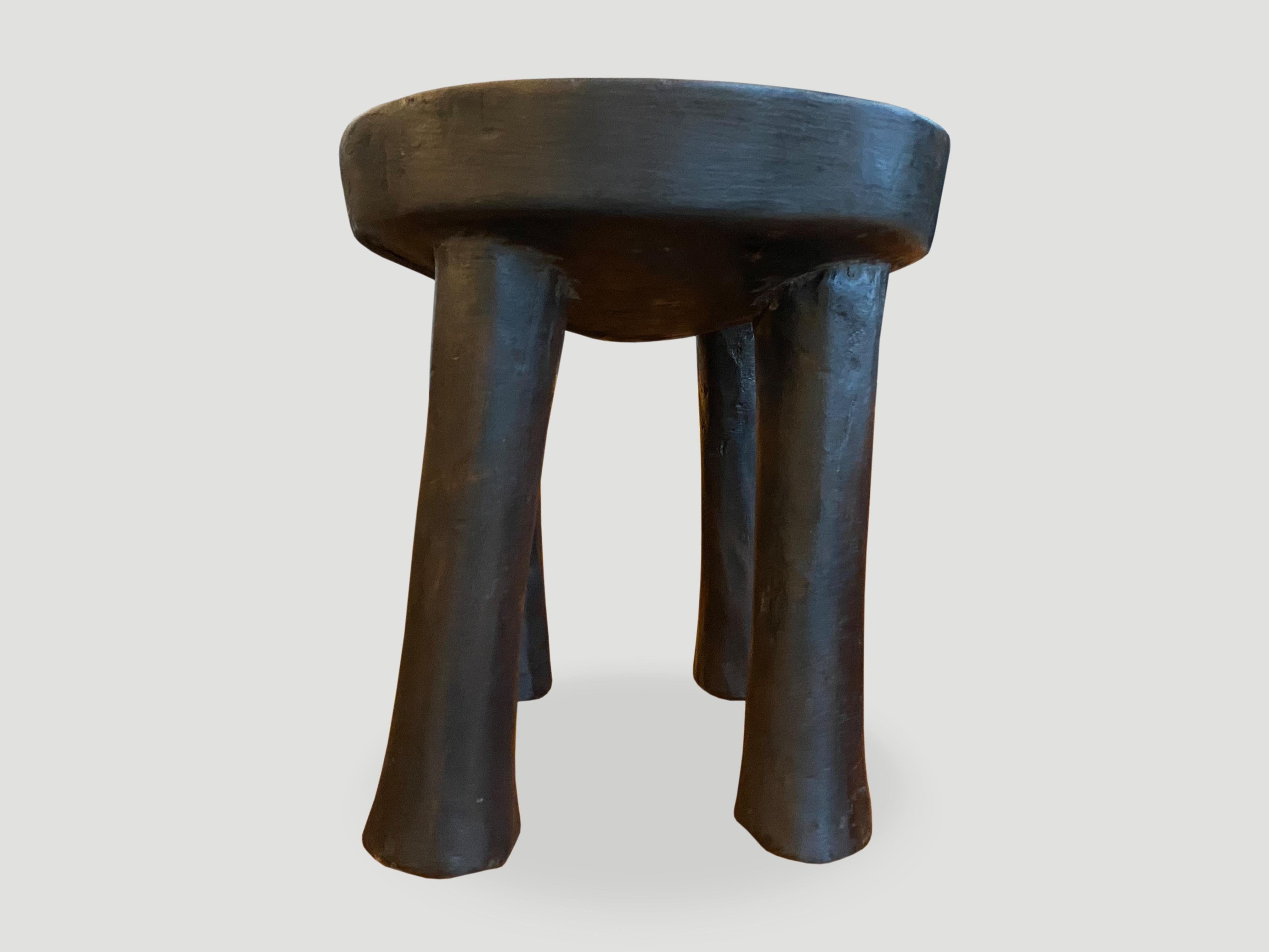 Hand carved African mahogany stool or side table. Great for placing a book or perhaps towels in a bathroom, magazines etc. Hand carved from a single piece of mahogany wood.

This stool or side table was sourced in the spirit of wabi-sabi, a