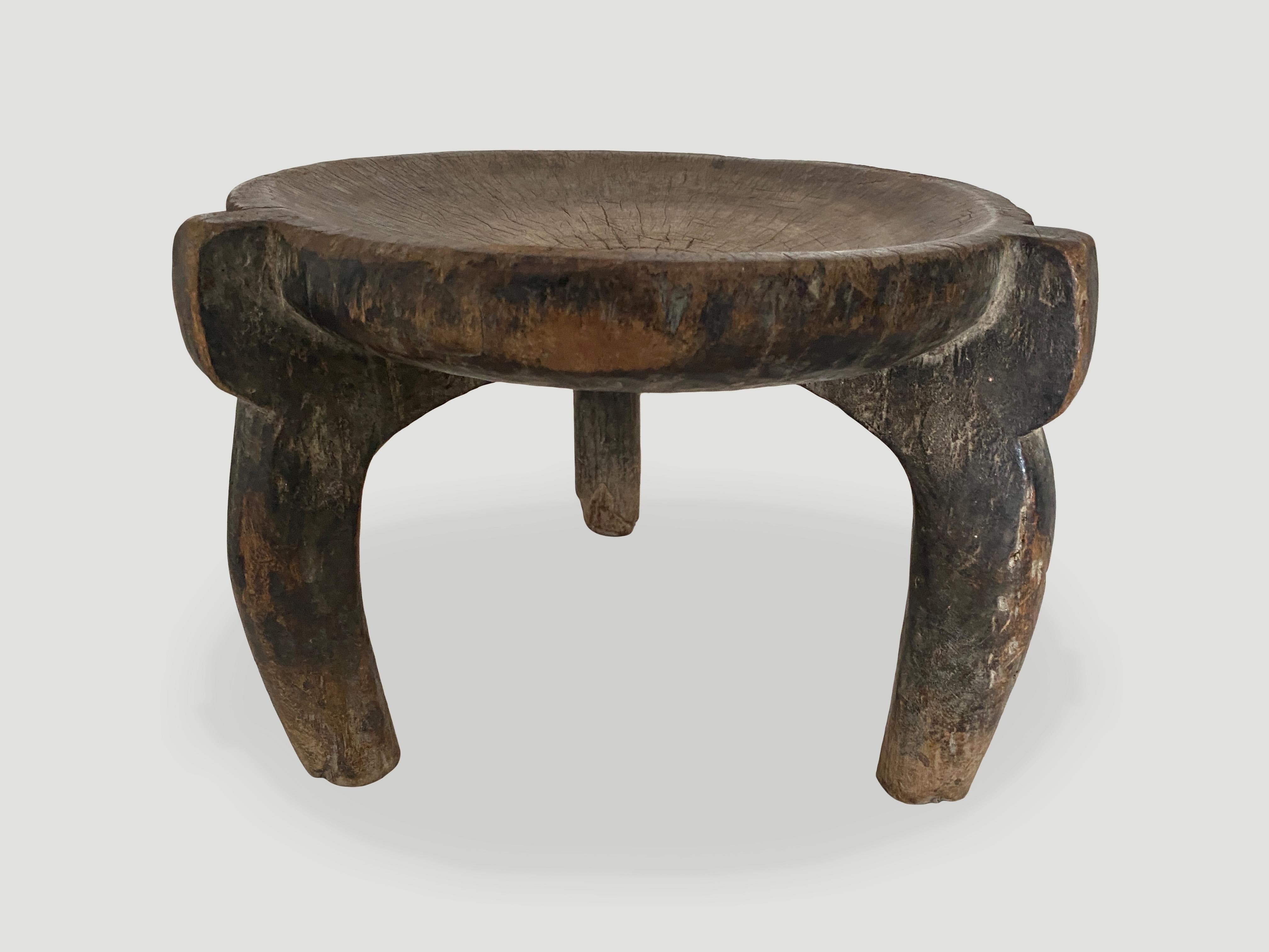 Beautiful hand carved African stool, side table or bowl with lovely patina. The entire piece is hand carved out of a single block of wood. Both sculptural and usable. We only select the best.

This stool, side table or bowl was sourced in the