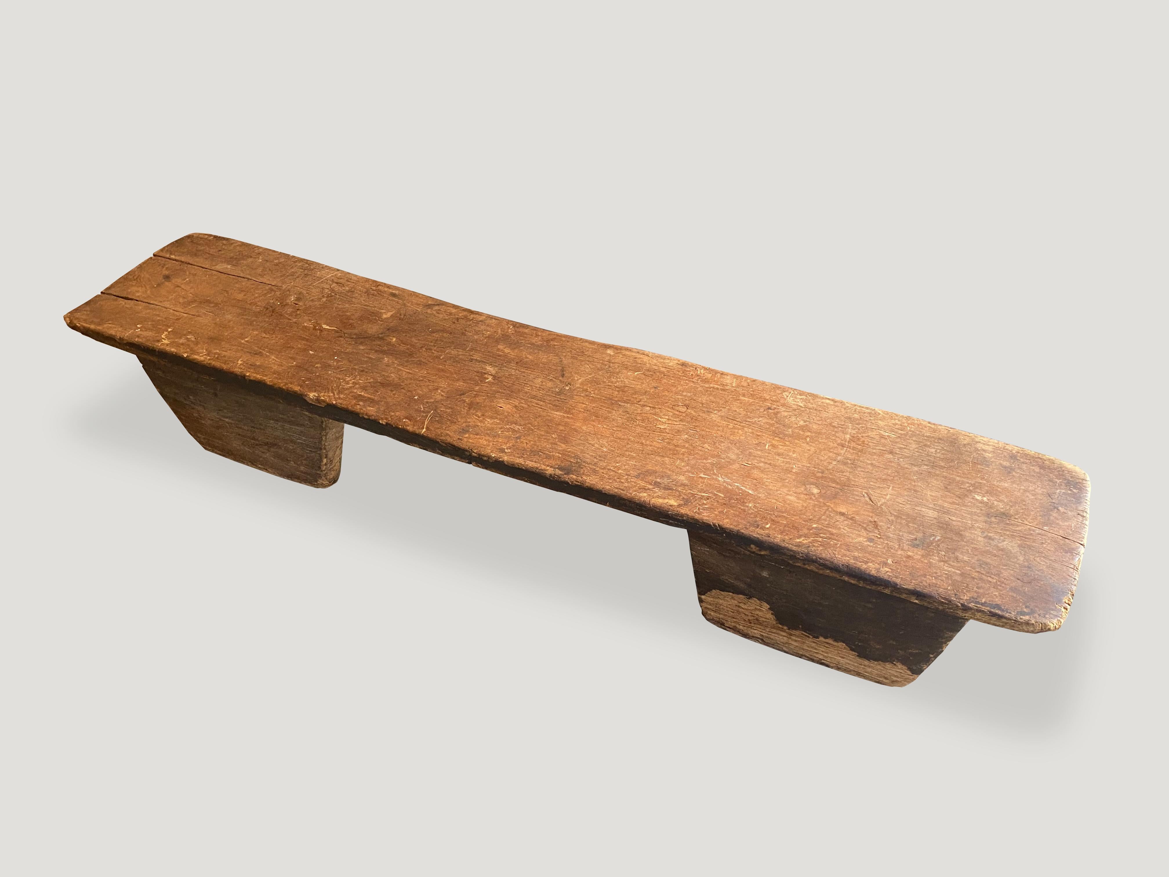Beautiful rare African antique coffee table or bench. The entire piece is hand carved from a single block of wood with lovely patina, celebrating the cracks and crevices and all the other marks that time and loving use have left behind. 

This