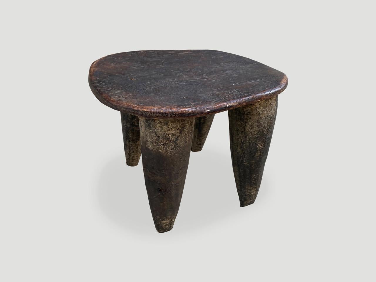 Lovely patina on this beautiful African stool hand carved from a single block of wood. Great for placing a book or perhaps towels in a bathroom, magazines etc.

This stool was sourced in the spirit of wabi-sabi, a Japanese philosophy that beauty