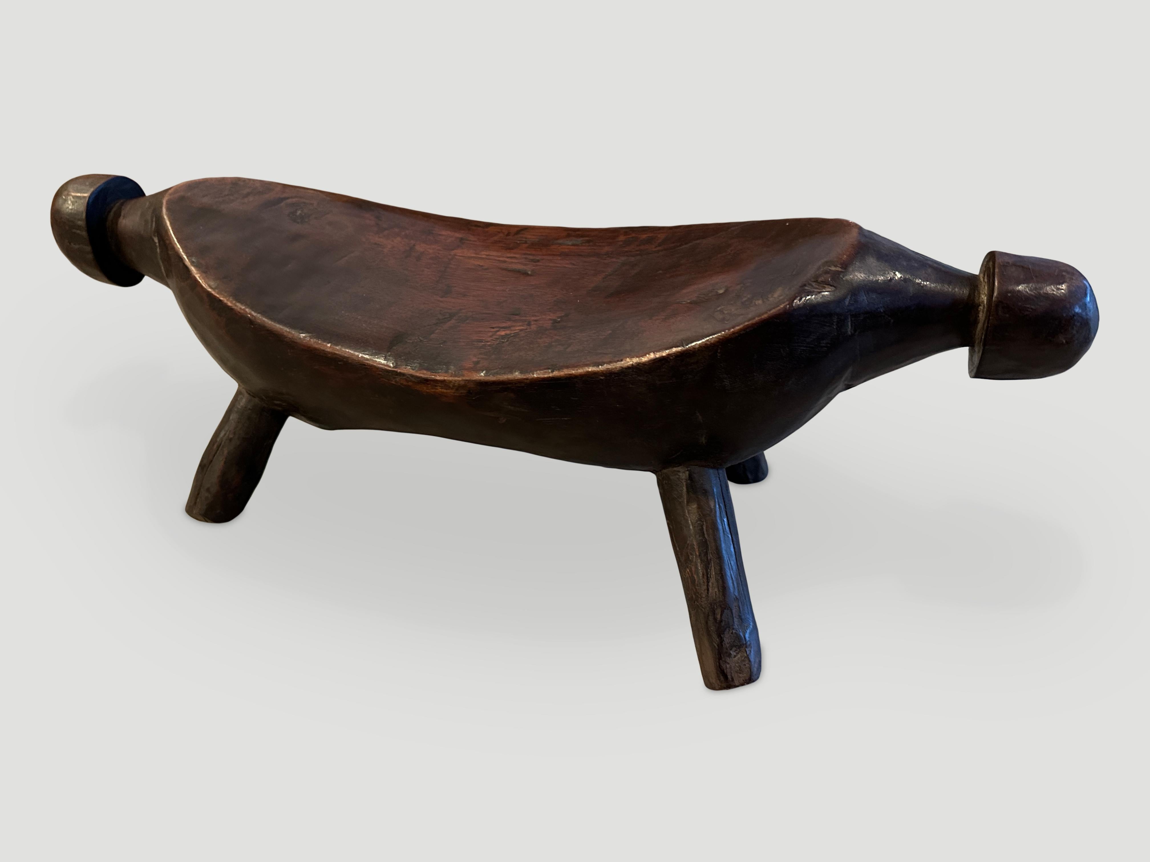Beautiful museum quality, wooden head rest. Stunning patina on this rare piece of art from Sudan. Hand carved from a single block of wood by the Dinka tribe, circa 1900

This head rest was sourced in the spirit of Wabi-Sabi, a Japanese philosophy
