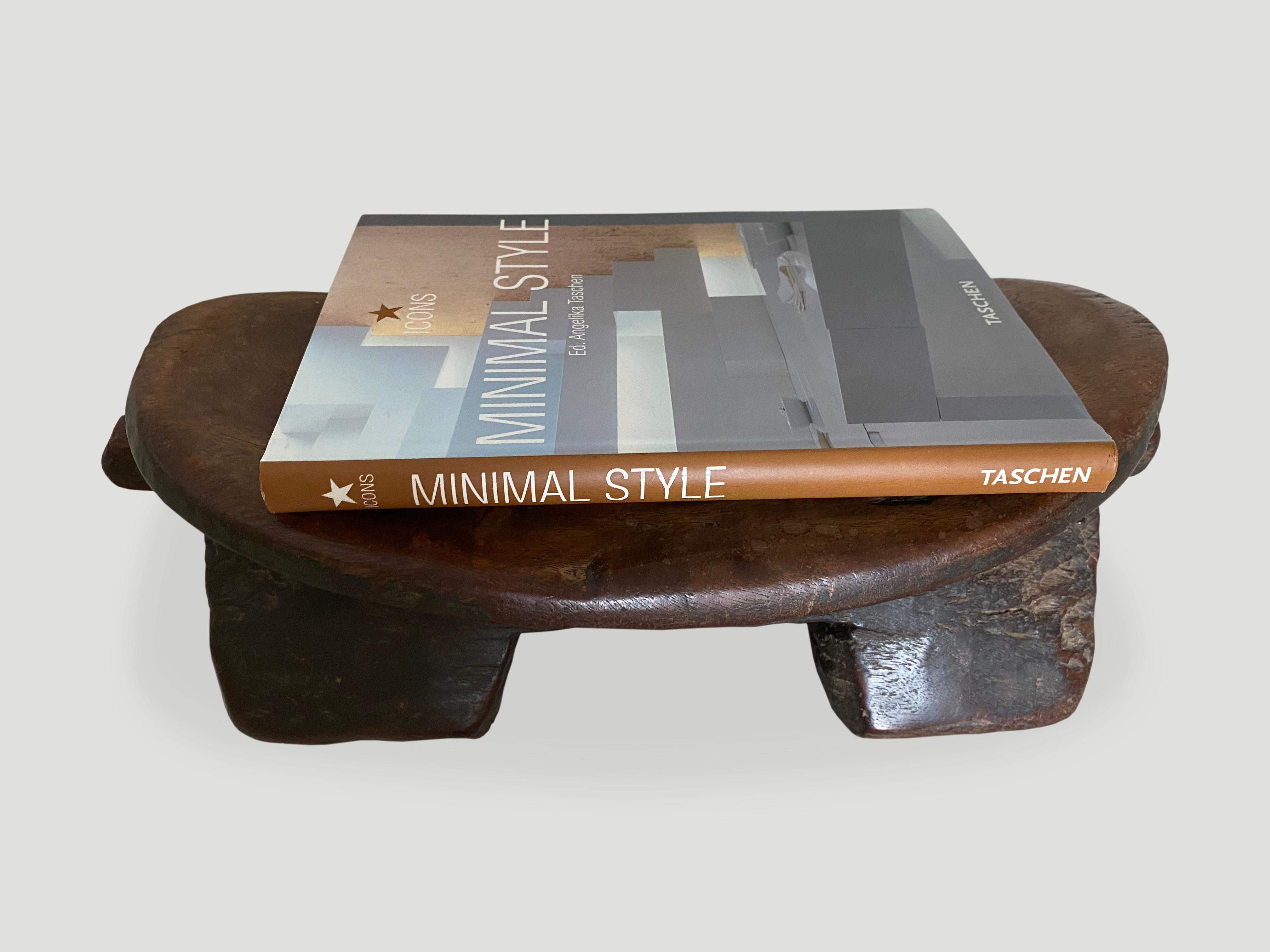 Beautiful museum quality African stool hand carved from a single block of wood. Lovely patina and markings through out celebrating time and loving use. This almost feels like leather and a true piece of art. Great for placing a book or perhaps