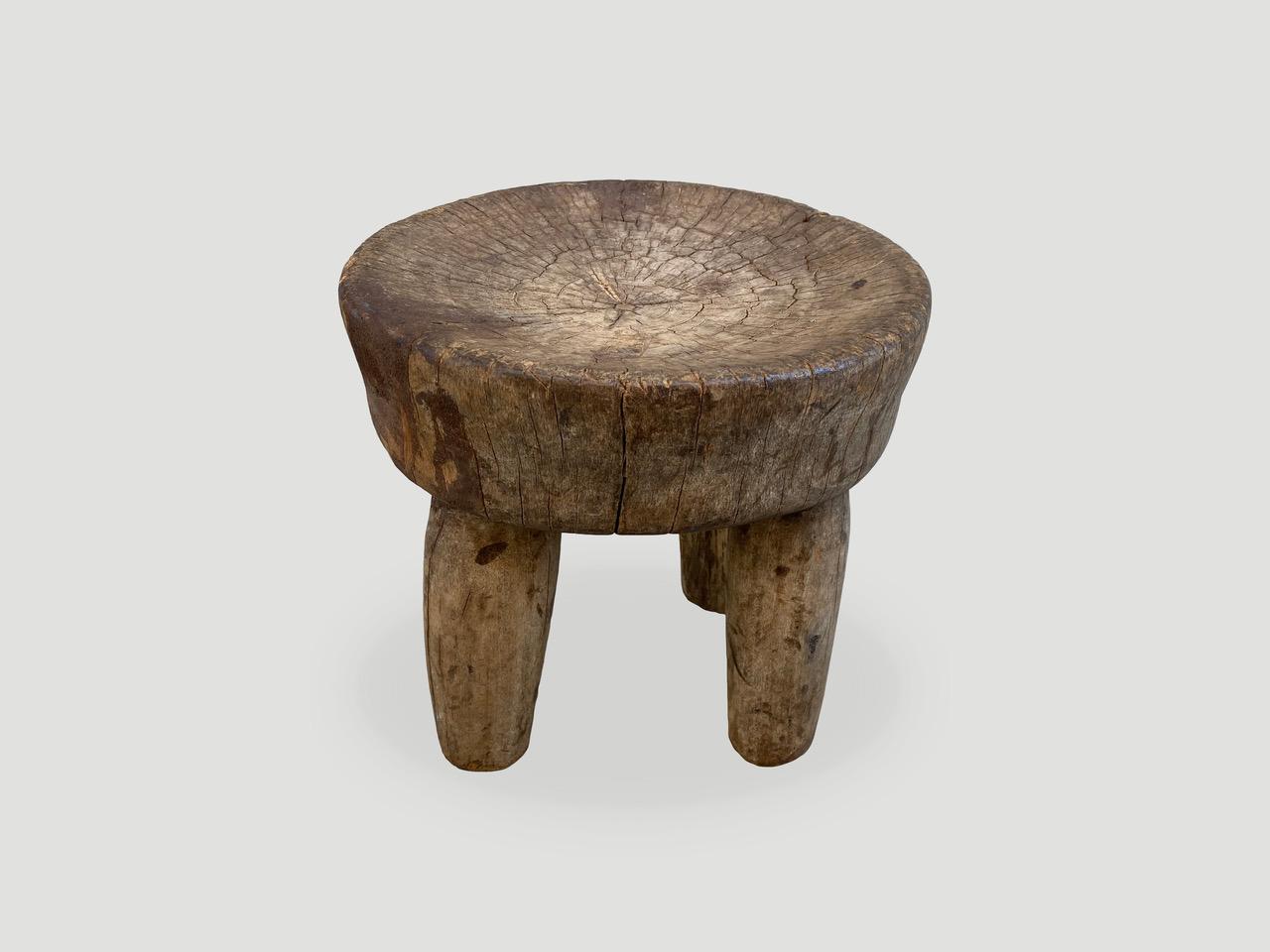 Antique African side table or stool, hand carved from a single block of wood celebrating the cracks and crevices that time and loving use have left behind. We only source the best.

This side table or stool was sourced in the spirit of wabi-sabi,
