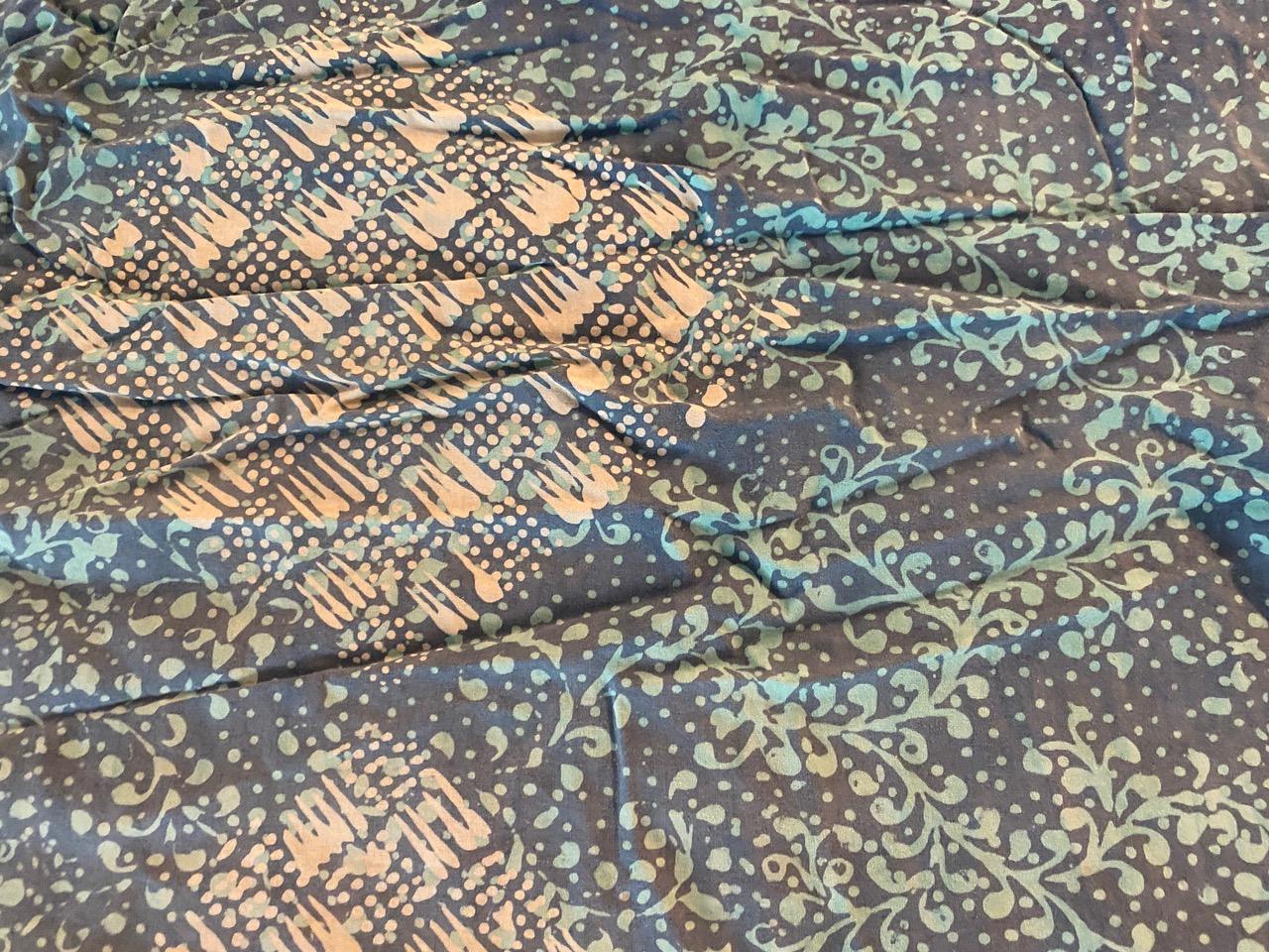 Beautiful antique ceremonial sarong from Bali. There are so many uses for these soft cotton batiks. Batik is an Indonesian technique of wax-resist dyeing applied to the entire textile. We have a collection. This one is sewn into a circle to step