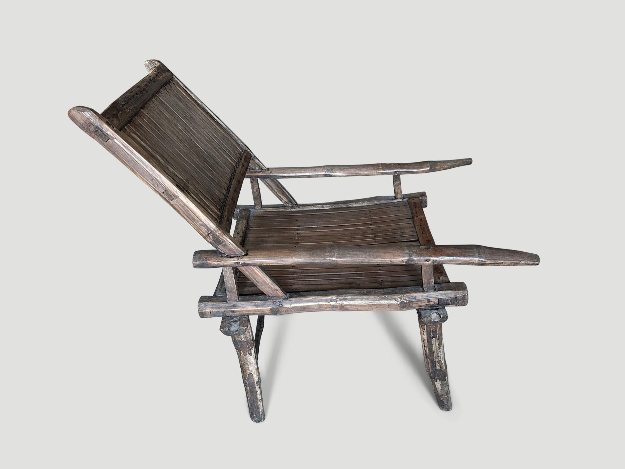 Beautiful patina on this hand made antique bamboo ‘ lazy’ chair. The back rest tilts and the arms are extended to allow legs to rest upon. Full dimensions; 20.5″ wide x 23″ deep x 18″ seat height x 28″ arm rest x 18″ back rest height. Circa