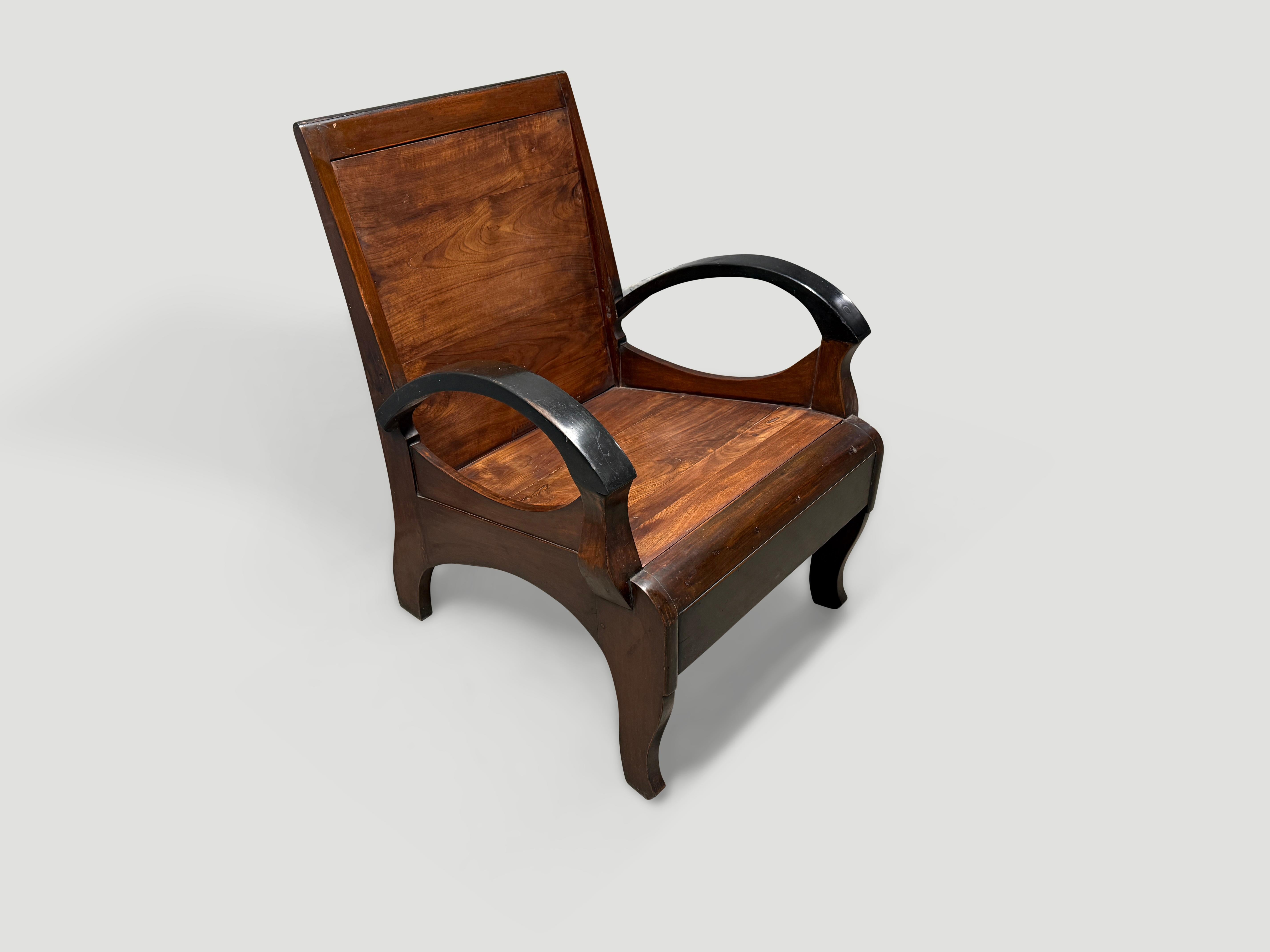 Beautiful carved arms on this antique Dutch Colonial chair from Indonesia. Circa 1950. Pair available. The price and images reflect one. Full dimensions; 23″ wide x 25″ deep x seat 15″ high x arm 9″ high x back rest 21″ high x total 32.5″