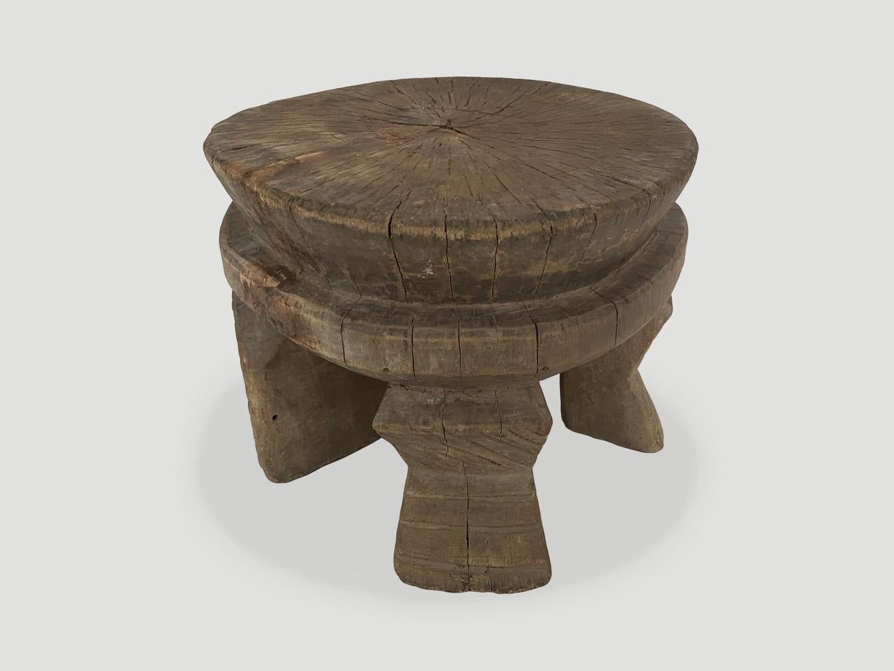 Beautiful African side table or stool hand carved from a single block of wood. Lovely markings through out celebrating the cracks and crevices and all the other marks that time and loving use have left behind. Rare unusual carved base. Both