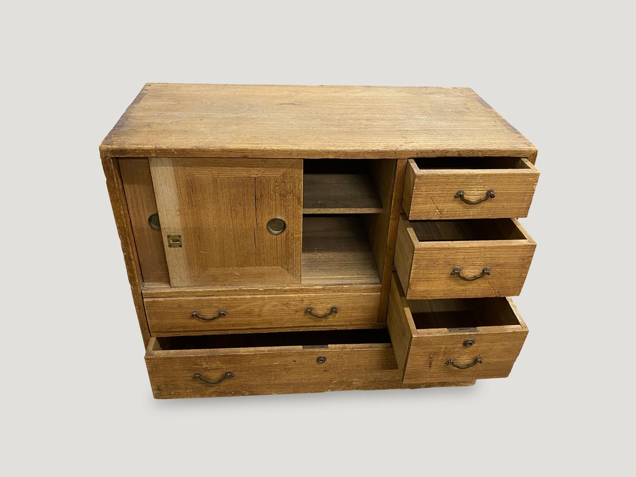 Japanese Kiri wood wabi sabi clothing chest from the 20th century in this hard to find miniature size. Great for storing jewelry, make up or accessories.

This miniature chest was sourced in the spirit of wabi-sabi, a Japanese philosophy that
