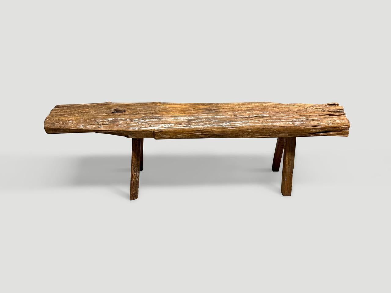 Antique bench with beautiful character hand made from a teak log with lovely patina. Circa 1950.

This bench was hand made in the spirit of Wabi-Sabi, a Japanese philosophy that beauty can be found in imperfection and impermanence. It is a beauty of