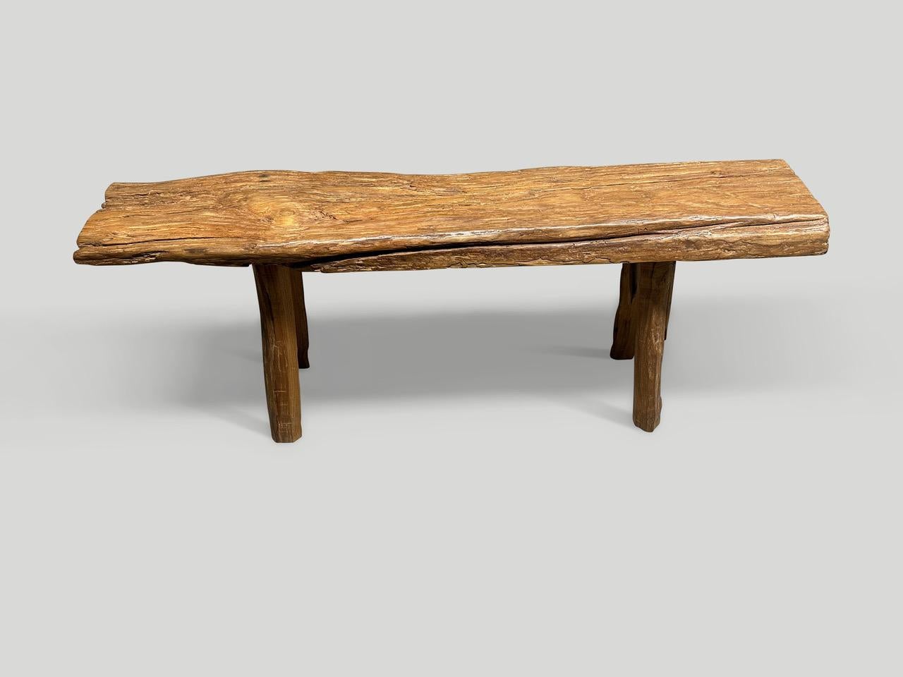 Antique bench with beautiful character hand made from a teak log with lovely patina. Circa 1950.

This bench was hand made in the spirit of Wabi-Sabi, a Japanese philosophy that beauty can be found in imperfection and impermanence. It is a beauty of