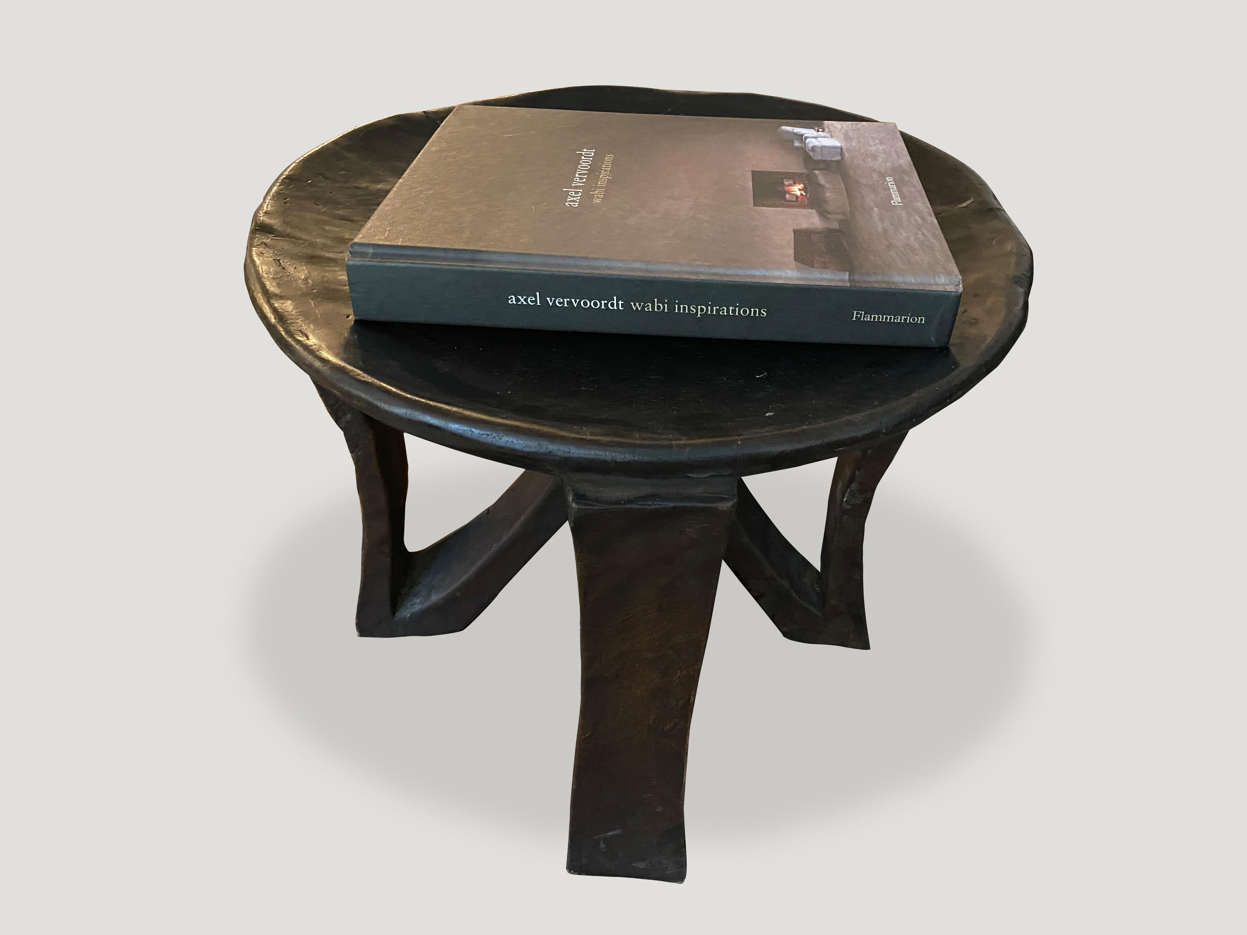 Hand carved from a single block of mahogany wood, an African mahogany side table or bowl. Great for placing a book or perhaps towels in a bathroom, magazines etc. A beautiful, versatile item that is both sculptural and usable. 

This side table or