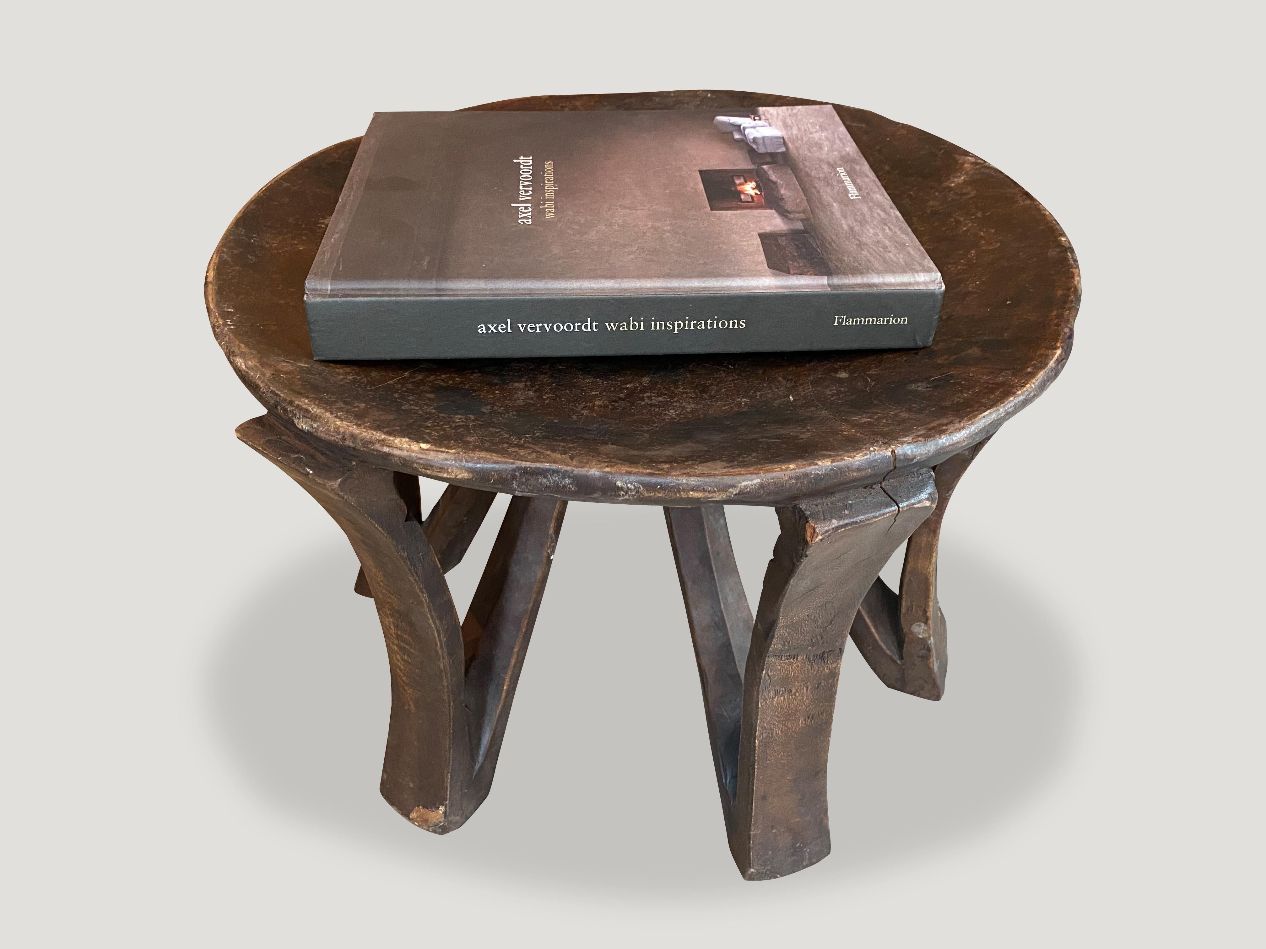 Hand carved from a single block of mahogany wood, an African mahogany side table or stool. Great for placing a book or perhaps towels in a bathroom, magazines etc. A beautiful, versatile item that is both sculptural and usable.

This side table or