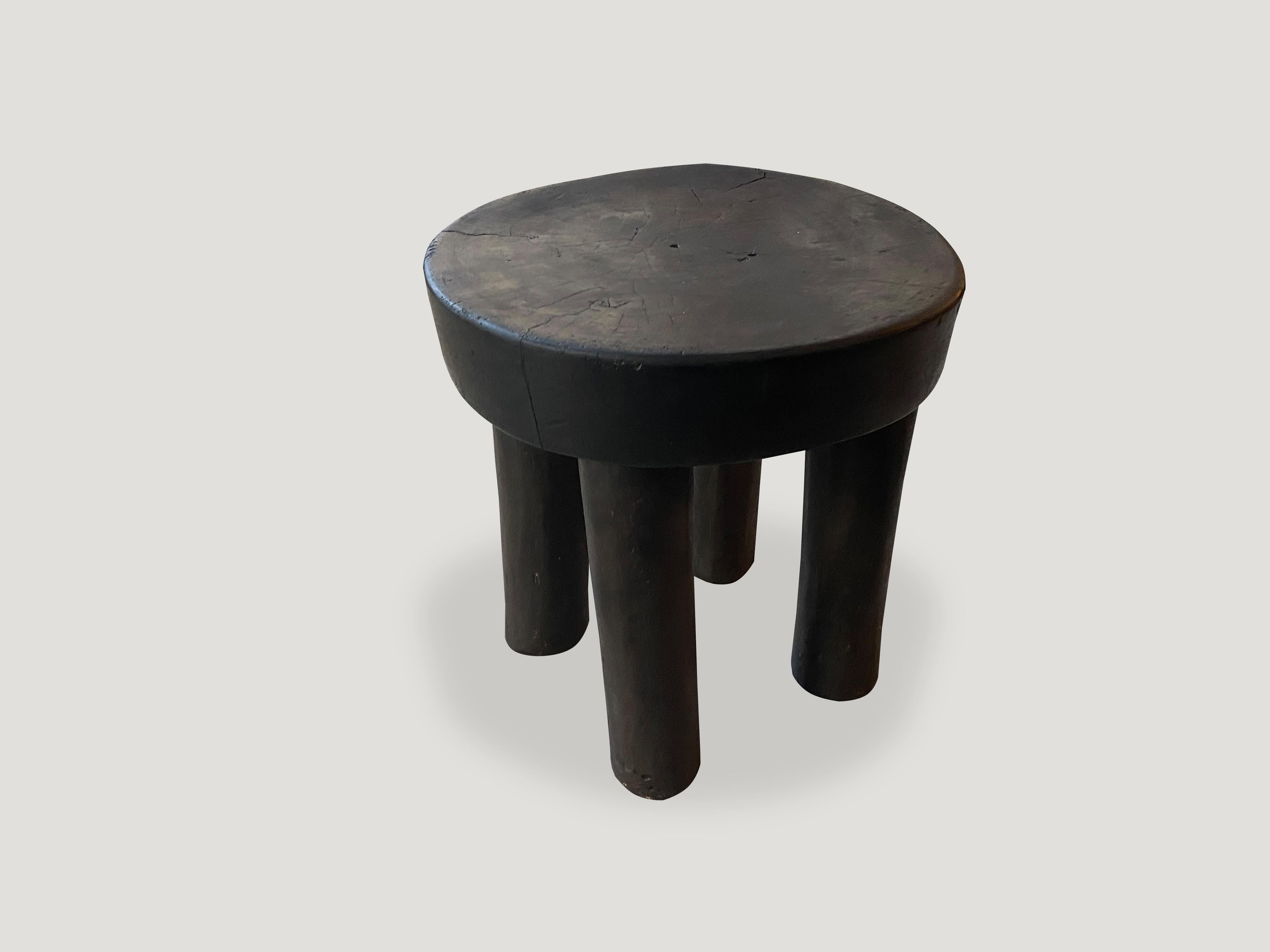 Hand carved African mahogany wood stool or side table. Great for placing a book or perhaps towels in a bathroom, magazines etc.

This stool or side table was sourced in the spirit of wabi-sabi, a Japanese philosophy that beauty can be found in