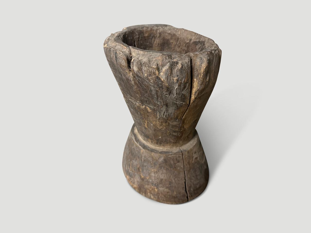 Sculptural small mortar originally used to grind spices. Hand carved from a single piece of teak wood. Full dimensions; Bottom 7
