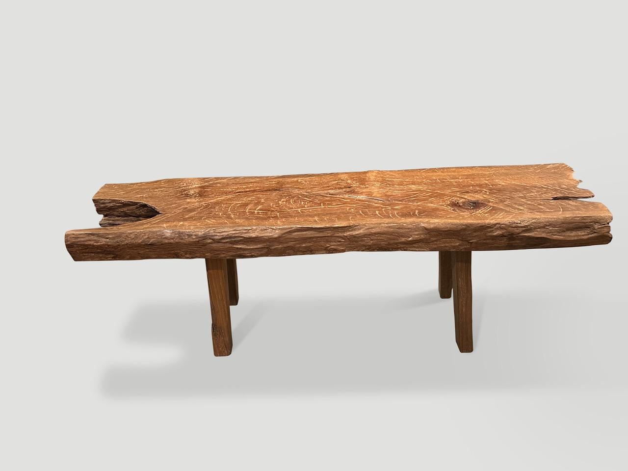 Impressive antique bench with beautiful character and patina. Hand made from a thick three inch teak log. Both sculptural and usable. Circa 1950.

This bench was hand made in the spirit of Wabi-Sabi, a Japanese philosophy that beauty can be found in